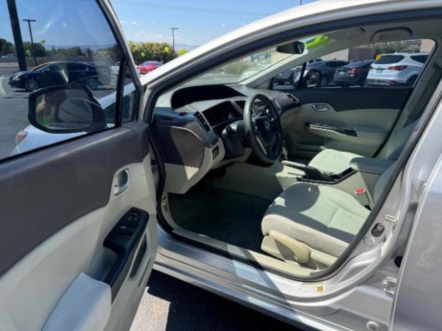 2012 Alabaster Silver Metallic /Gray Cloth Interior Honda Civic LX Sedan 5-Speed AT (2HGFB2F52CH) with an 1.8L L4 SOHC 16V engine, 5-Speed Automatic transmission, located at 1865 East Red Hills Pkwy, St. George, 84770, (435) 628-0023, 37.120850, -113.543640 - We specialize in helping ALL people get the best financing available. No matter your credit score, good, bad or none we can get you an amazing rate. Had a bankruptcy, divorce, or repossessions? We give you the green light to get your credit back on the road. Low down and affordable payments that fit - Photo#12