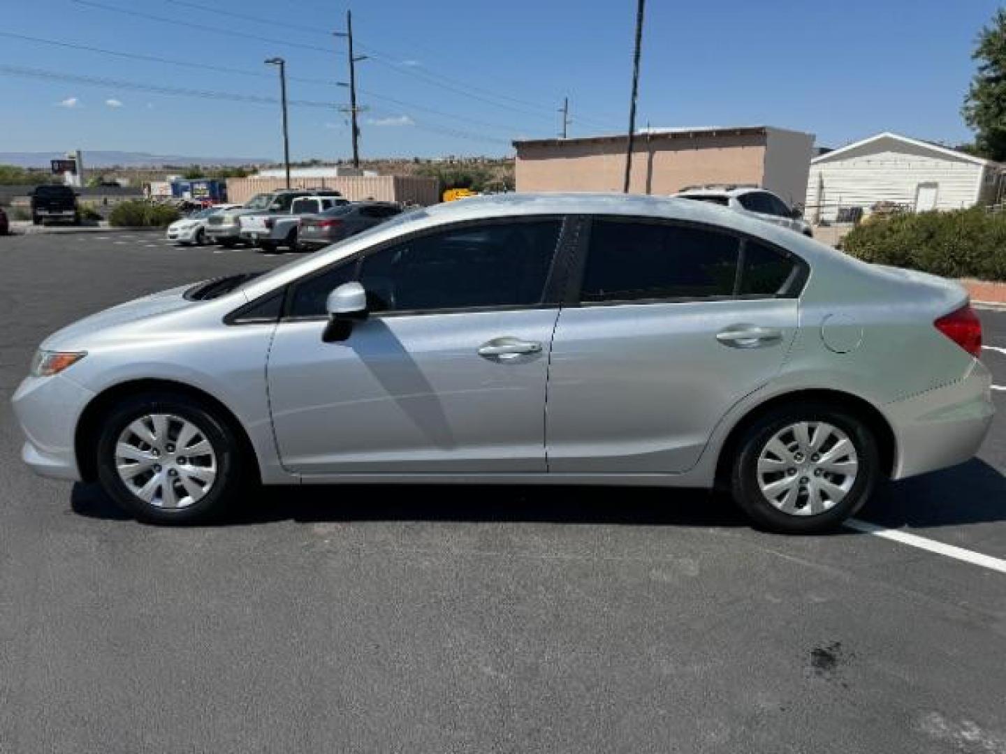 2012 Alabaster Silver Metallic /Gray Cloth Interior Honda Civic LX Sedan 5-Speed AT (2HGFB2F52CH) with an 1.8L L4 SOHC 16V engine, 5-Speed Automatic transmission, located at 1865 East Red Hills Pkwy, St. George, 84770, (435) 628-0023, 37.120850, -113.543640 - We specialize in helping ALL people get the best financing available. No matter your credit score, good, bad or none we can get you an amazing rate. Had a bankruptcy, divorce, or repossessions? We give you the green light to get your credit back on the road. Low down and affordable payments that fit - Photo#3