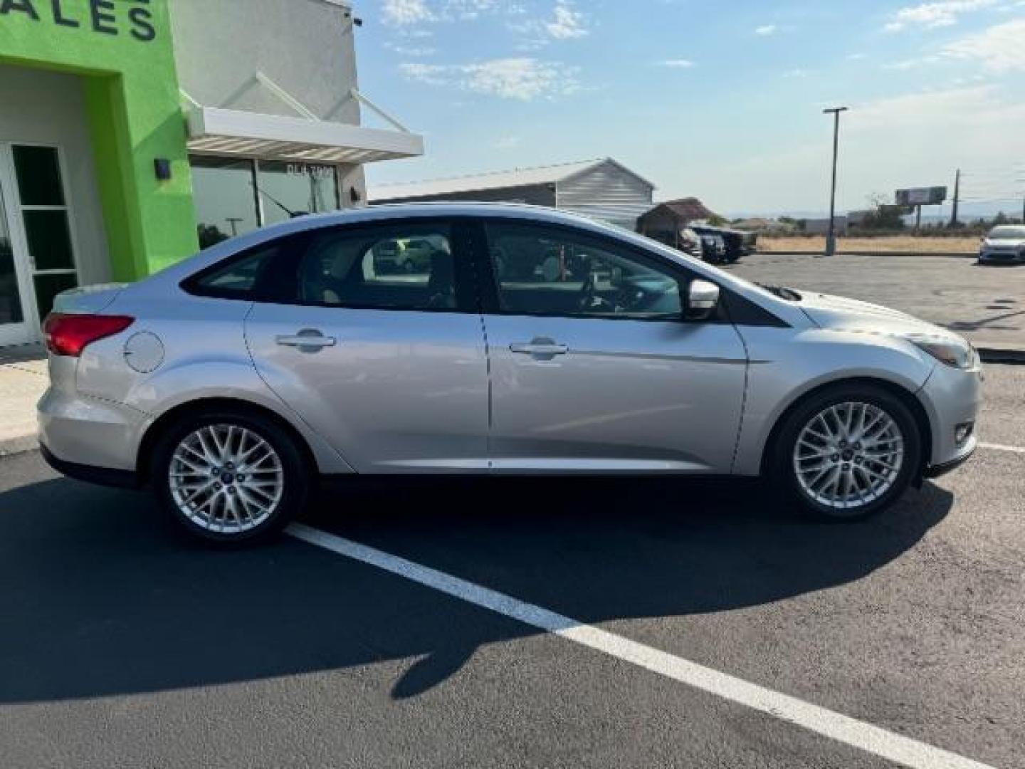 2017 Ingot Silver Metallic /Charcoal Black Insert w/Warm Steel Surround, cloth Ford Focus SEL Sedan (1FADP3H27HL) with an 2.0L L4 DOHC 16V engine, located at 940 North Main Street, Cedar City, UT, 84720, (435) 628-0023, 37.692936, -113.061897 - Photo#7