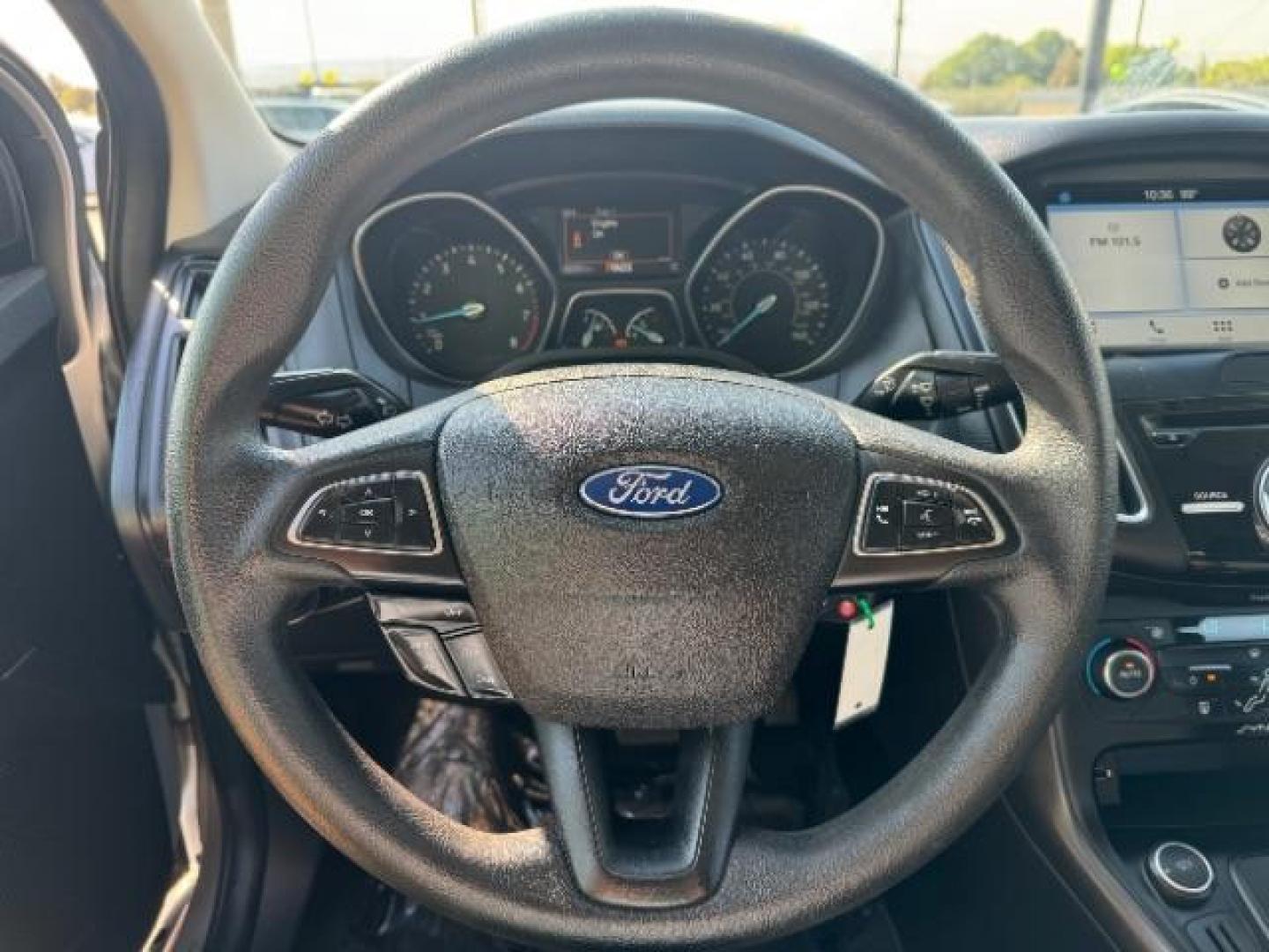 2017 Ingot Silver Metallic /Charcoal Black Insert w/Warm Steel Surround, cloth Ford Focus SEL Sedan (1FADP3H27HL) with an 2.0L L4 DOHC 16V engine, located at 940 North Main Street, Cedar City, UT, 84720, (435) 628-0023, 37.692936, -113.061897 - Photo#17