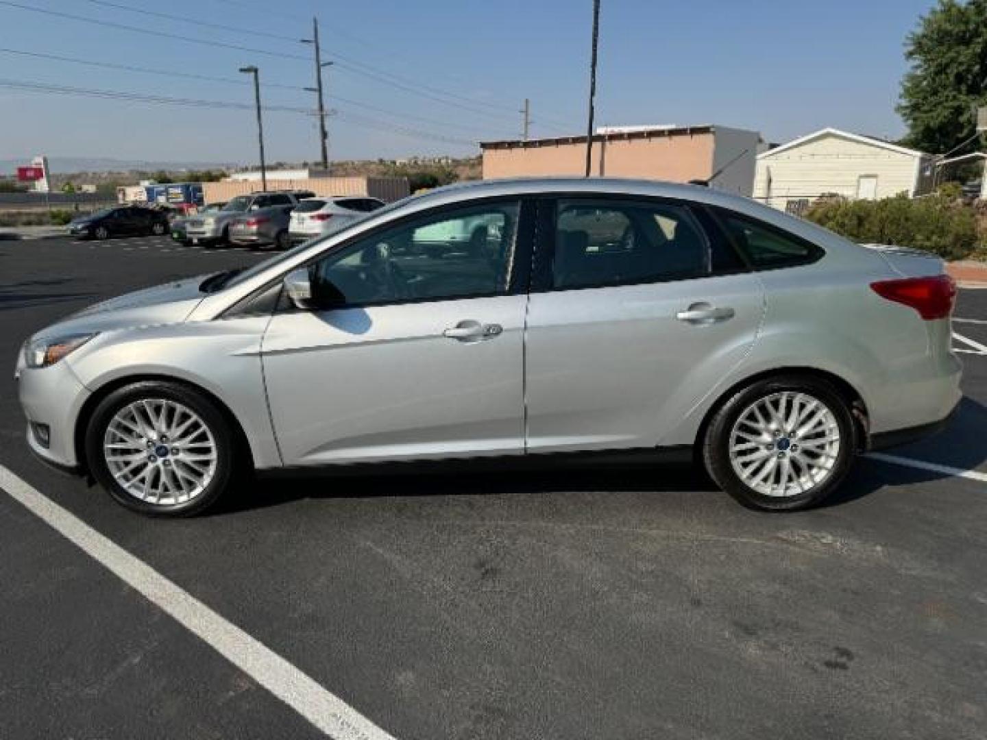 2017 Ingot Silver Metallic /Charcoal Black Insert w/Warm Steel Surround, cloth Ford Focus SEL Sedan (1FADP3H27HL) with an 2.0L L4 DOHC 16V engine, located at 940 North Main Street, Cedar City, UT, 84720, (435) 628-0023, 37.692936, -113.061897 - We specialize in helping ALL people get the best financing available. No matter your credit score, good, bad or none we can get you an amazing rate. Had a bankruptcy, divorce, or repossessions? We give you the green light to get your credit back on the road. Low down and affordable payments that fit - Photo#3