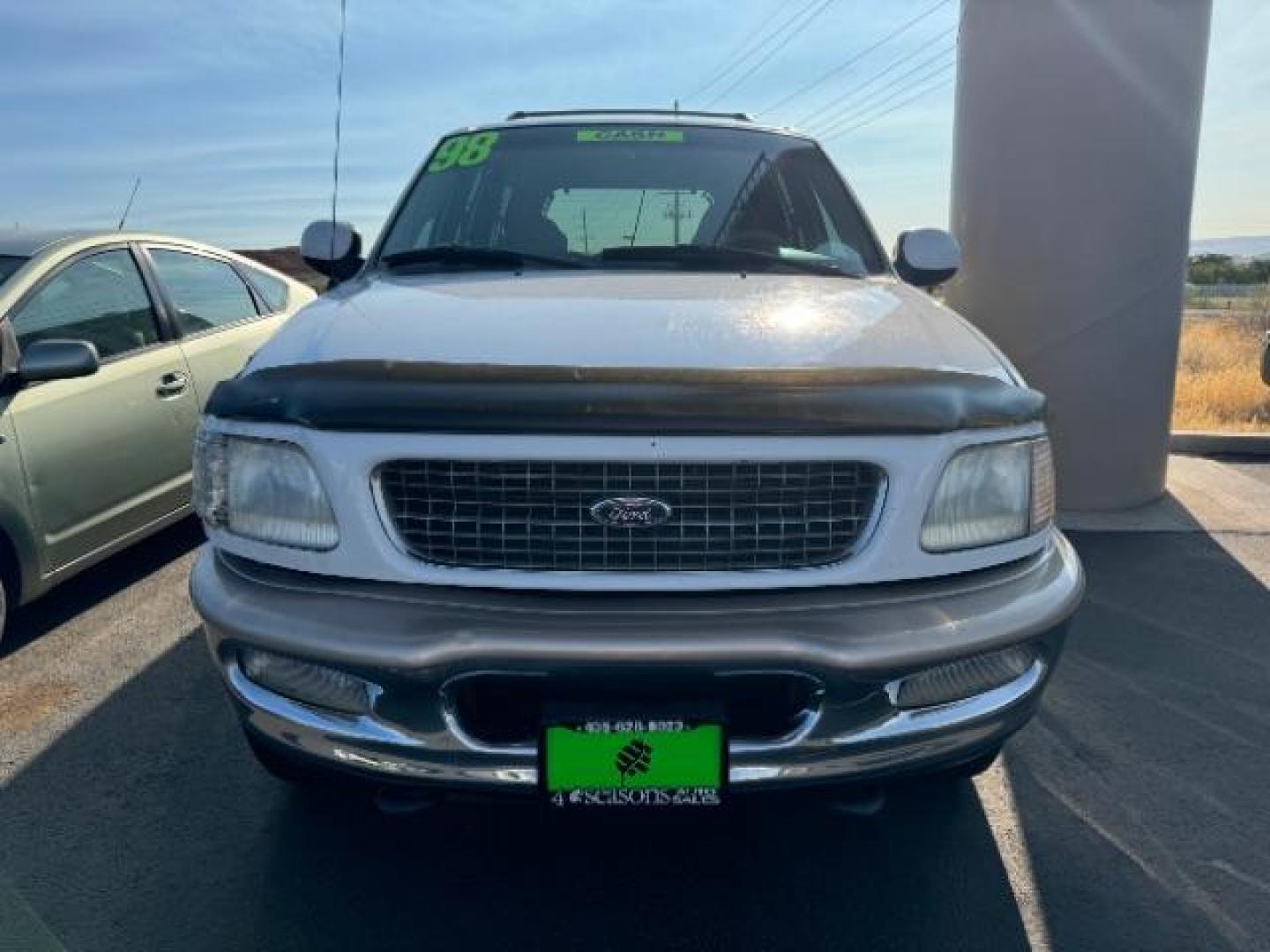 1998 Oxford White Clearcoat /Medium Prairie Tan Leather Ford Expedition Eddie Bauer 4WD (1FMPU18L6WL) with an 5.4L V8 SOHC 16V engine, 4-Speed Automatic transmission, located at 1865 East Red Hills Pkwy, St. George, 84770, (435) 628-0023, 37.120850, -113.543640 - This vehicle is a Mechanic Special. This means it will need some love. Runs a drives fine but has body damage, leaks or other mechanical issues. It did NOT pass our 50 point inspection. Get a great deal on a less than perfect car. These cars do NOT qualify for our in house financing. Cash and carry, - Photo#1