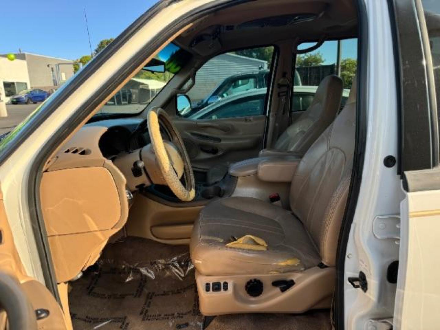 1998 Oxford White Clearcoat /Medium Prairie Tan Leather Ford Expedition Eddie Bauer 4WD (1FMPU18L6WL) with an 5.4L V8 SOHC 16V engine, 4-Speed Automatic transmission, located at 1865 East Red Hills Pkwy, St. George, 84770, (435) 628-0023, 37.120850, -113.543640 - This vehicle is a Mechanic Special. This means it will need some love. Runs a drives fine but has body damage, leaks or other mechanical issues. It did NOT pass our 50 point inspection. Get a great deal on a less than perfect car. These cars do NOT qualify for our in house financing. Cash and carry, - Photo#6