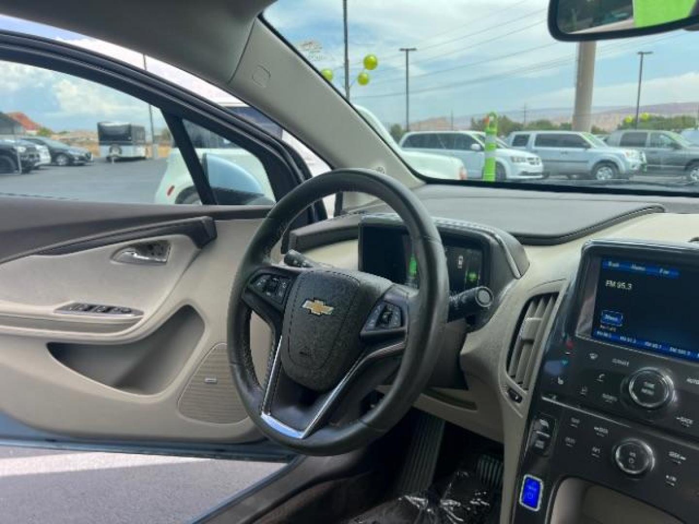 2014 Blue /Tan Cloth Interior Chevrolet Volt Premium w/ Navigation and LEP (1G1RH6E45EU) with an 1.4L L4 DOHC 16V PLUG-IN HYBRID engine, Continuously Variable Transmission transmission, located at 940 North Main Street, Cedar City, UT, 84720, (435) 628-0023, 37.692936, -113.061897 - ***This vehicle qualifies for the EV/Hybrid tax rebate of up to $4,000*** We are setup with the IRS to recieve direct payments within 72 hours. We file the rebate online with IRS and can credit it to your down payment, reduce the sales price OR give you cashback!! These cars will not last and can o - Photo#8