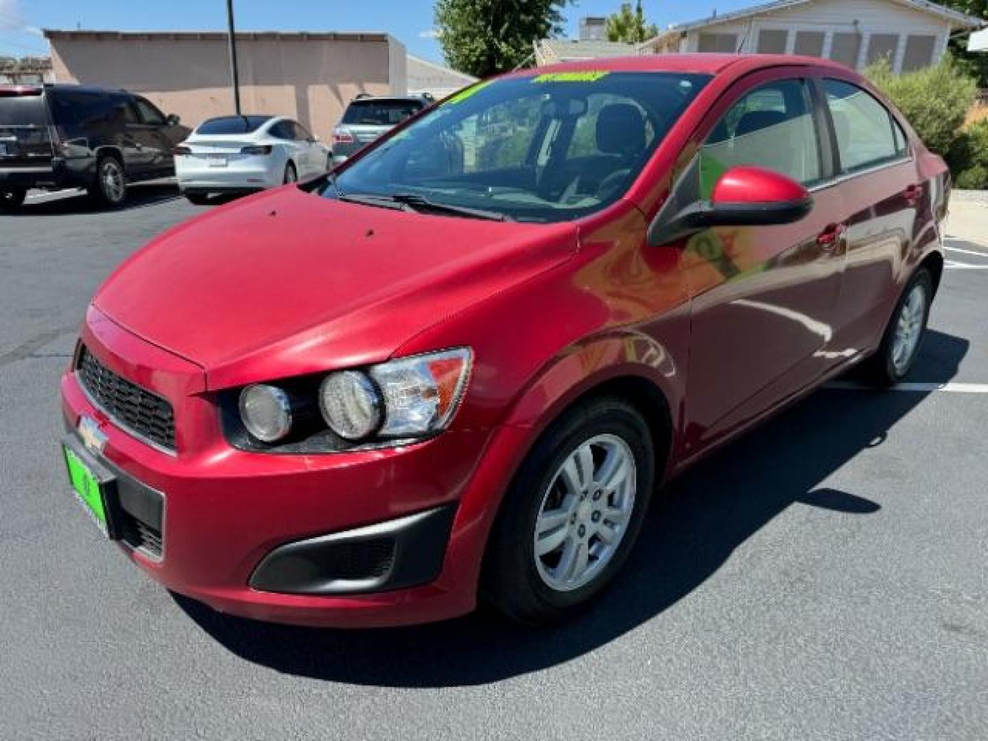 2014 Crystal Red Tintcoat /Jet Black/Dark Titanium Chevrolet Sonic LT Auto Sedan (1G1JC5SH5E4) with an 1.8L L4 DOHC 24V engine, 6-Speed Automatic transmission, located at 1865 East Red Hills Pkwy, St. George, 84770, (435) 628-0023, 37.120850, -113.543640 - We specialize in helping ALL people get the best financing available. No matter your credit score, good, bad or none we can get you an amazing rate. Had a bankruptcy, divorce, or repossessions? We give you the green light to get your credit back on the road. Low down and affordable payments that fit - Photo#2