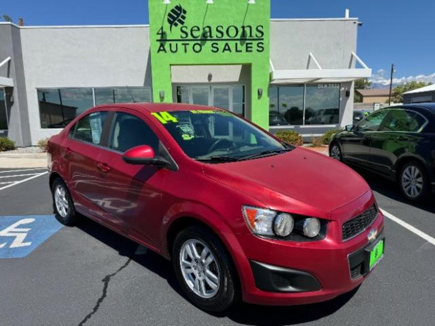 2014 Crystal Red Tintcoat /Jet Black/Dark Titanium Chevrolet Sonic LT Auto Sedan (1G1JC5SH5E4) with an 1.8L L4 DOHC 24V engine, 6-Speed Automatic transmission, located at 940 North Main Street, Cedar City, UT, 84720, (435) 628-0023, 37.692936, -113.061897 - We specialize in helping ALL people get the best financing available. No matter your credit score, good, bad or none we can get you an amazing rate. Had a bankruptcy, divorce, or repossessions? We give you the green light to get your credit back on the road. Low down and affordable payments that fit - Photo#0