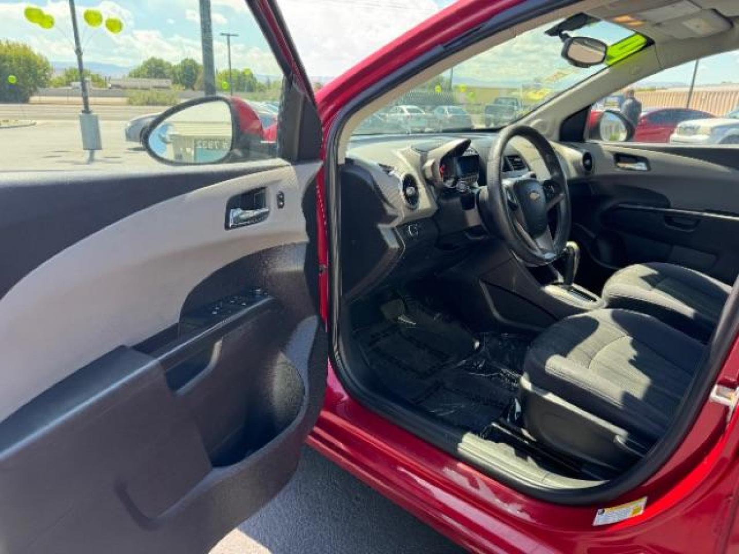 2014 Crystal Red Tintcoat /Jet Black/Dark Titanium Chevrolet Sonic LT Auto Sedan (1G1JC5SH5E4) with an 1.8L L4 DOHC 24V engine, 6-Speed Automatic transmission, located at 940 North Main Street, Cedar City, UT, 84720, (435) 628-0023, 37.692936, -113.061897 - We specialize in helping ALL people get the best financing available. No matter your credit score, good, bad or none we can get you an amazing rate. Had a bankruptcy, divorce, or repossessions? We give you the green light to get your credit back on the road. Low down and affordable payments that fit - Photo#12