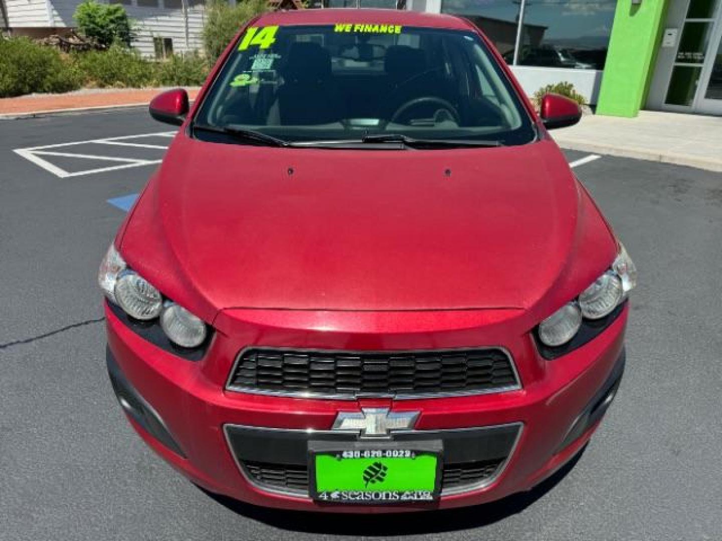 2014 Crystal Red Tintcoat /Jet Black/Dark Titanium Chevrolet Sonic LT Auto Sedan (1G1JC5SH5E4) with an 1.8L L4 DOHC 24V engine, 6-Speed Automatic transmission, located at 940 North Main Street, Cedar City, UT, 84720, (435) 628-0023, 37.692936, -113.061897 - We specialize in helping ALL people get the best financing available. No matter your credit score, good, bad or none we can get you an amazing rate. Had a bankruptcy, divorce, or repossessions? We give you the green light to get your credit back on the road. Low down and affordable payments that fit - Photo#1