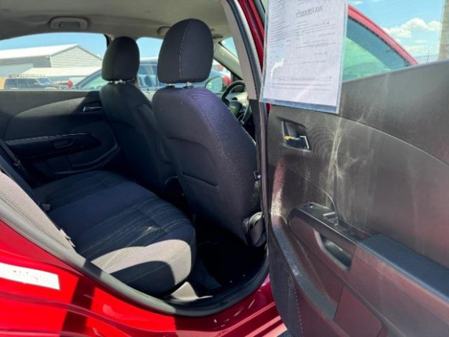 2014 Crystal Red Tintcoat /Jet Black/Dark Titanium Chevrolet Sonic LT Auto Sedan (1G1JC5SH5E4) with an 1.8L L4 DOHC 24V engine, 6-Speed Automatic transmission, located at 940 North Main Street, Cedar City, UT, 84720, (435) 628-0023, 37.692936, -113.061897 - We specialize in helping ALL people get the best financing available. No matter your credit score, good, bad or none we can get you an amazing rate. Had a bankruptcy, divorce, or repossessions? We give you the green light to get your credit back on the road. Low down and affordable payments that fit - Photo#27