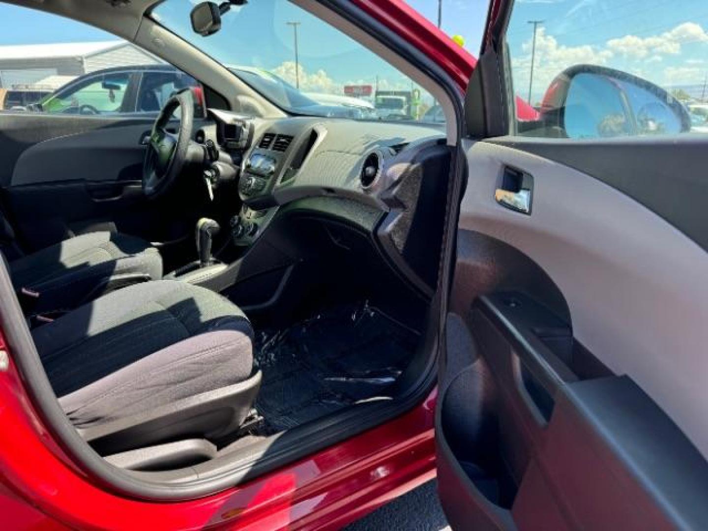 2014 Crystal Red Tintcoat /Jet Black/Dark Titanium Chevrolet Sonic LT Auto Sedan (1G1JC5SH5E4) with an 1.8L L4 DOHC 24V engine, 6-Speed Automatic transmission, located at 940 North Main Street, Cedar City, UT, 84720, (435) 628-0023, 37.692936, -113.061897 - We specialize in helping ALL people get the best financing available. No matter your credit score, good, bad or none we can get you an amazing rate. Had a bankruptcy, divorce, or repossessions? We give you the green light to get your credit back on the road. Low down and affordable payments that fit - Photo#29