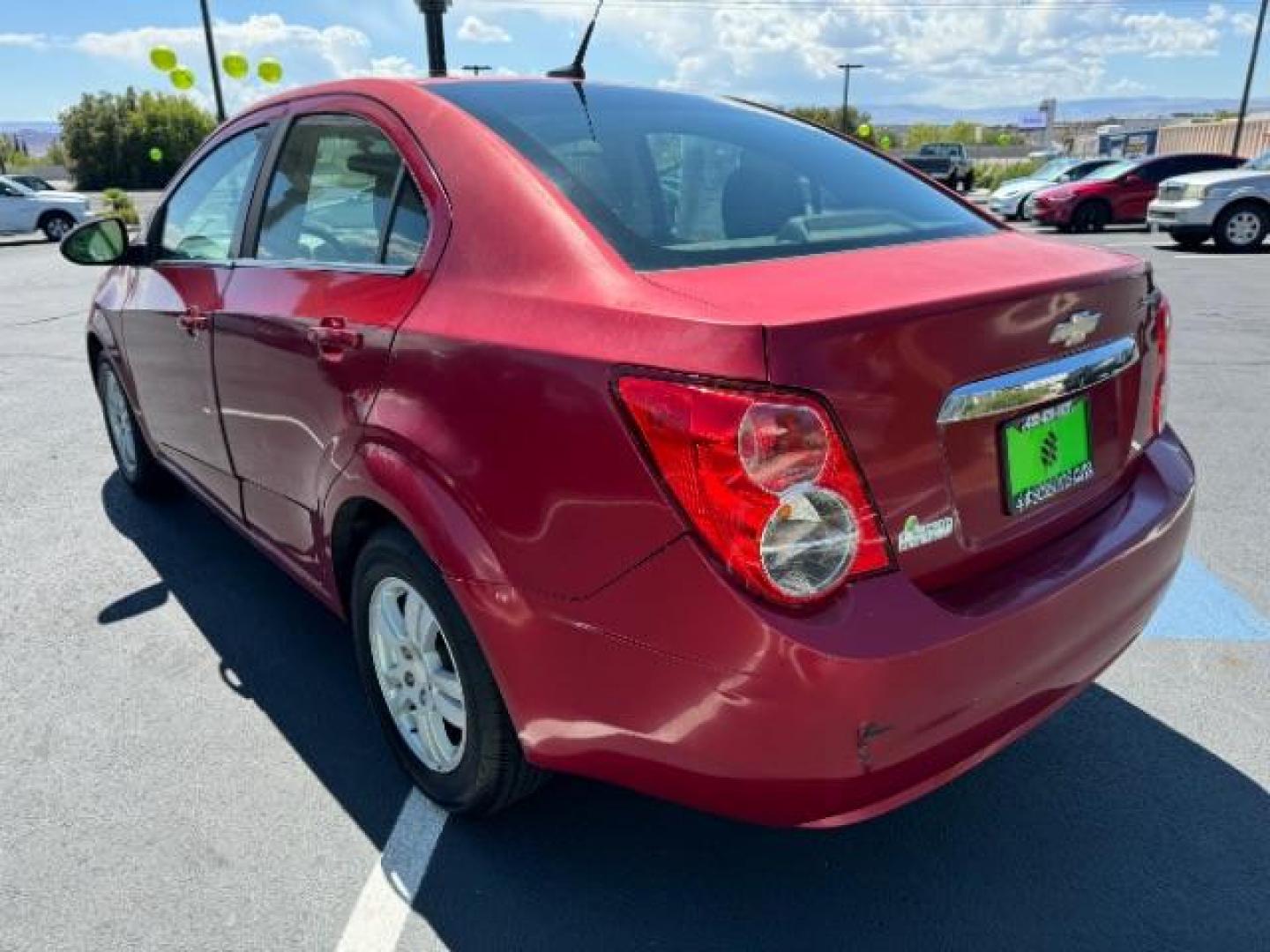 2014 Crystal Red Tintcoat /Jet Black/Dark Titanium Chevrolet Sonic LT Auto Sedan (1G1JC5SH5E4) with an 1.8L L4 DOHC 24V engine, 6-Speed Automatic transmission, located at 940 North Main Street, Cedar City, UT, 84720, (435) 628-0023, 37.692936, -113.061897 - We specialize in helping ALL people get the best financing available. No matter your credit score, good, bad or none we can get you an amazing rate. Had a bankruptcy, divorce, or repossessions? We give you the green light to get your credit back on the road. Low down and affordable payments that fit - Photo#4