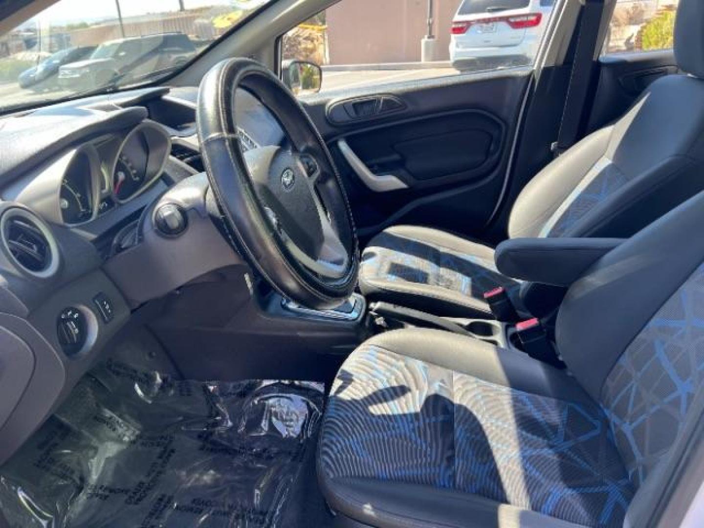 2012 Oxford White /Charcoal Black/Blue Cloth Interior Ford Fiesta SE Sedan (3FADP4BJ1CM) with an 1.6L L4 DOHC 16V engine, 6-Speed Automatic transmission, located at 940 North Main Street, Cedar City, UT, 84720, (435) 628-0023, 37.692936, -113.061897 - We specialize in helping ALL people get the best financing available. No matter your credit score, good, bad or none we can get you an amazing rate. Had a bankruptcy, divorce, or repossessions? We give you the green light to get your credit back on the road. Low down and affordable payments that fit - Photo#12