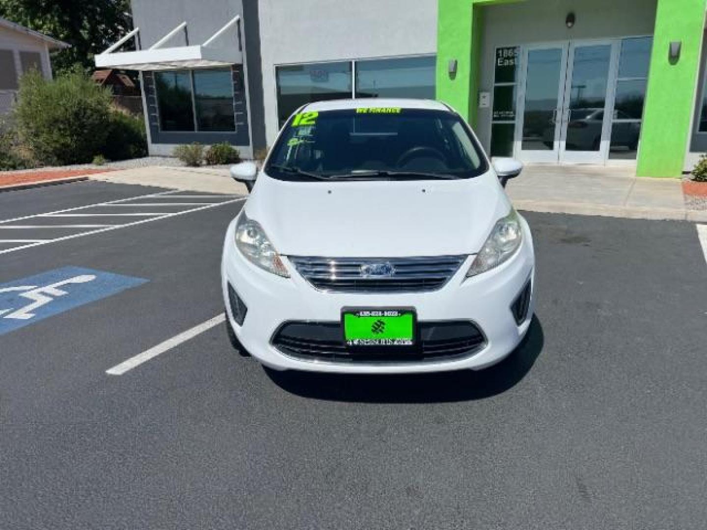 2012 Oxford White /Charcoal Black/Blue Cloth Interior Ford Fiesta SE Sedan (3FADP4BJ1CM) with an 1.6L L4 DOHC 16V engine, 6-Speed Automatic transmission, located at 940 North Main Street, Cedar City, UT, 84720, (435) 628-0023, 37.692936, -113.061897 - We specialize in helping ALL people get the best financing available. No matter your credit score, good, bad or none we can get you an amazing rate. Had a bankruptcy, divorce, or repossessions? We give you the green light to get your credit back on the road. Low down and affordable payments that fit - Photo#1