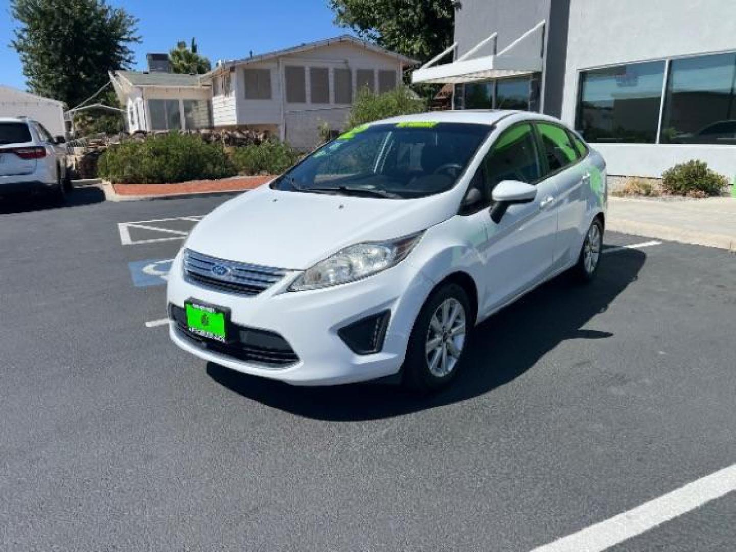 2012 Oxford White /Charcoal Black/Blue Cloth Interior Ford Fiesta SE Sedan (3FADP4BJ1CM) with an 1.6L L4 DOHC 16V engine, 6-Speed Automatic transmission, located at 940 North Main Street, Cedar City, UT, 84720, (435) 628-0023, 37.692936, -113.061897 - We specialize in helping ALL people get the best financing available. No matter your credit score, good, bad or none we can get you an amazing rate. Had a bankruptcy, divorce, or repossessions? We give you the green light to get your credit back on the road. Low down and affordable payments that fit - Photo#2