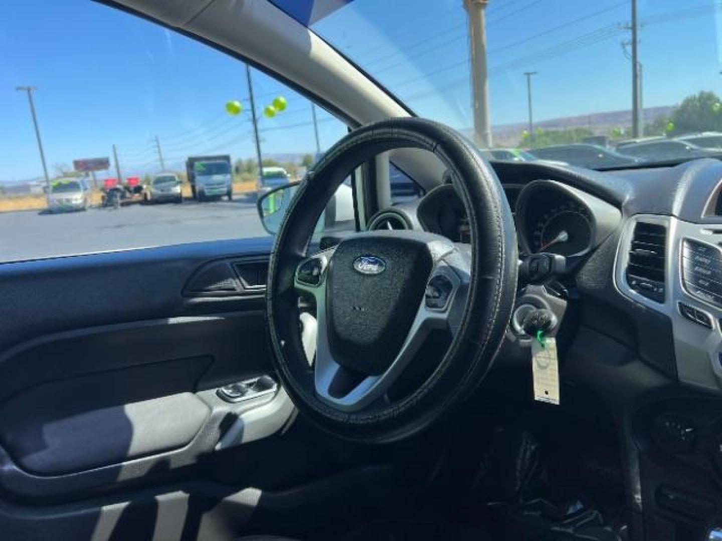 2012 Oxford White /Charcoal Black/Blue Cloth Interior Ford Fiesta SE Sedan (3FADP4BJ1CM) with an 1.6L L4 DOHC 16V engine, 6-Speed Automatic transmission, located at 940 North Main Street, Cedar City, UT, 84720, (435) 628-0023, 37.692936, -113.061897 - We specialize in helping ALL people get the best financing available. No matter your credit score, good, bad or none we can get you an amazing rate. Had a bankruptcy, divorce, or repossessions? We give you the green light to get your credit back on the road. Low down and affordable payments that fit - Photo#31