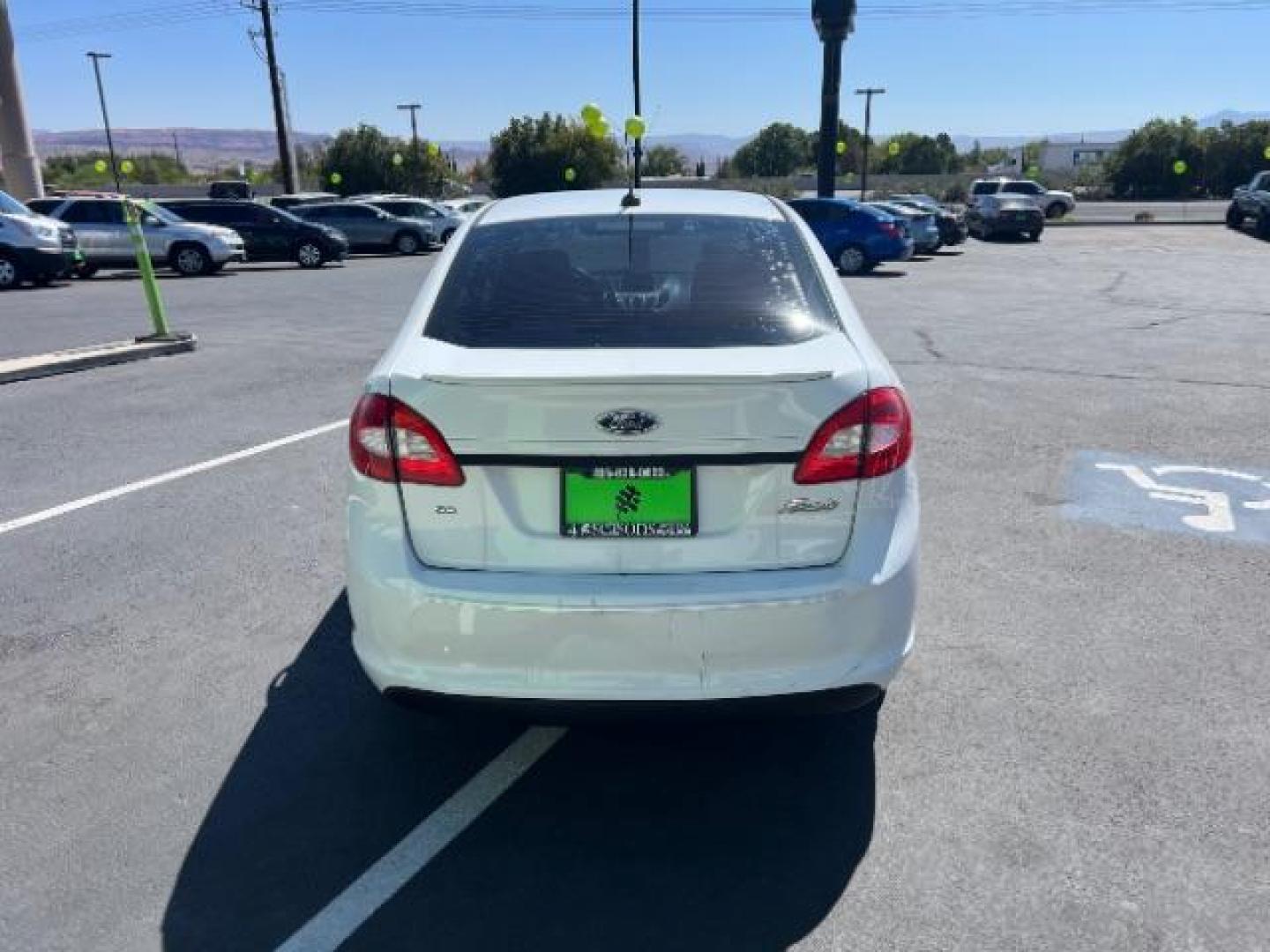 2012 Oxford White /Charcoal Black/Blue Cloth Interior Ford Fiesta SE Sedan (3FADP4BJ1CM) with an 1.6L L4 DOHC 16V engine, 6-Speed Automatic transmission, located at 940 North Main Street, Cedar City, UT, 84720, (435) 628-0023, 37.692936, -113.061897 - We specialize in helping ALL people get the best financing available. No matter your credit score, good, bad or none we can get you an amazing rate. Had a bankruptcy, divorce, or repossessions? We give you the green light to get your credit back on the road. Low down and affordable payments that fit - Photo#5