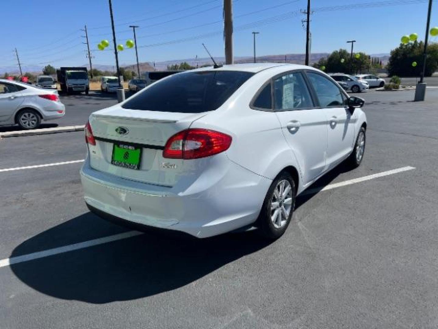 2012 Oxford White /Charcoal Black/Blue Cloth Interior Ford Fiesta SE Sedan (3FADP4BJ1CM) with an 1.6L L4 DOHC 16V engine, 6-Speed Automatic transmission, located at 940 North Main Street, Cedar City, UT, 84720, (435) 628-0023, 37.692936, -113.061897 - We specialize in helping ALL people get the best financing available. No matter your credit score, good, bad or none we can get you an amazing rate. Had a bankruptcy, divorce, or repossessions? We give you the green light to get your credit back on the road. Low down and affordable payments that fit - Photo#6