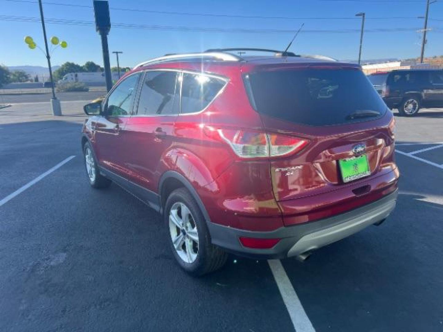 2015 Ruby Red Met Tinted CC /Charcoal Black Ford Escape SE FWD (1FMCU0G79FU) with an 2.5L L4 DOHC 16V engine, 6-Speed Automatic transmission, located at 940 North Main Street, Cedar City, UT, 84720, (435) 628-0023, 37.692936, -113.061897 - Photo#6