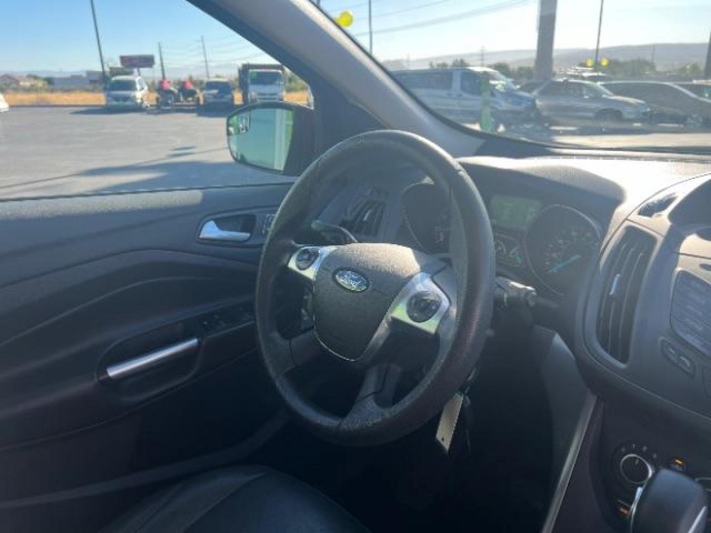 2015 Ruby Red Met Tinted CC /Charcoal Black Ford Escape SE FWD (1FMCU0G79FU) with an 2.5L L4 DOHC 16V engine, 6-Speed Automatic transmission, located at 940 North Main Street, Cedar City, UT, 84720, (435) 628-0023, 37.692936, -113.061897 - Photo#32