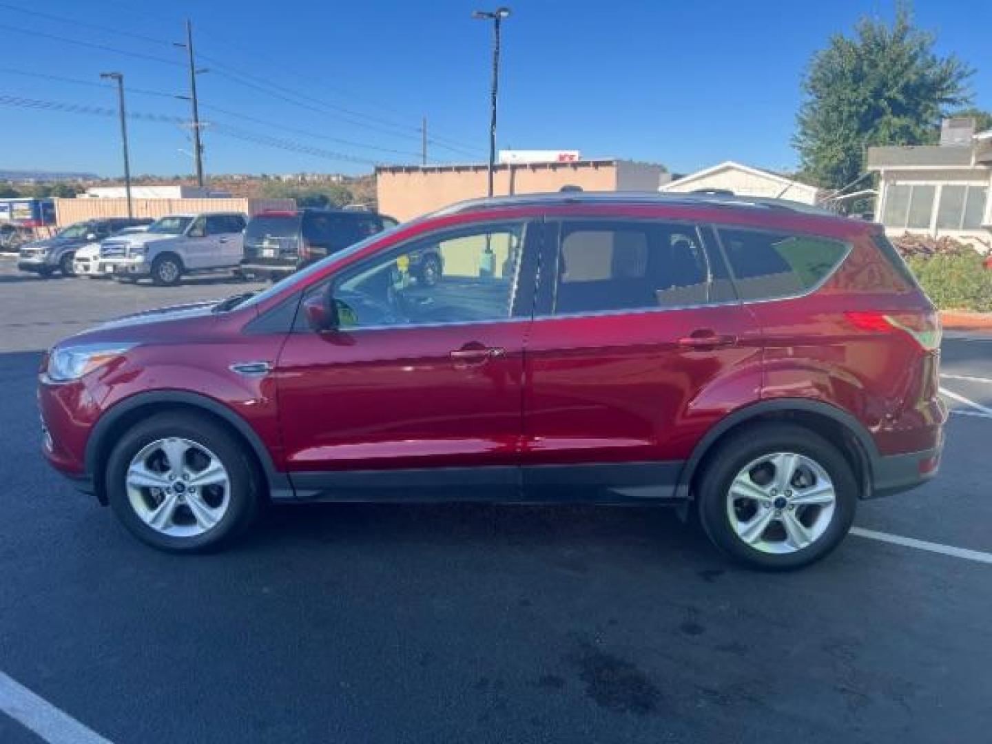 2015 Ruby Red Met Tinted CC /Charcoal Black Ford Escape SE FWD (1FMCU0G79FU) with an 2.5L L4 DOHC 16V engine, 6-Speed Automatic transmission, located at 1865 East Red Hills Pkwy, St. George, 84770, (435) 628-0023, 37.120850, -113.543640 - Photo#3