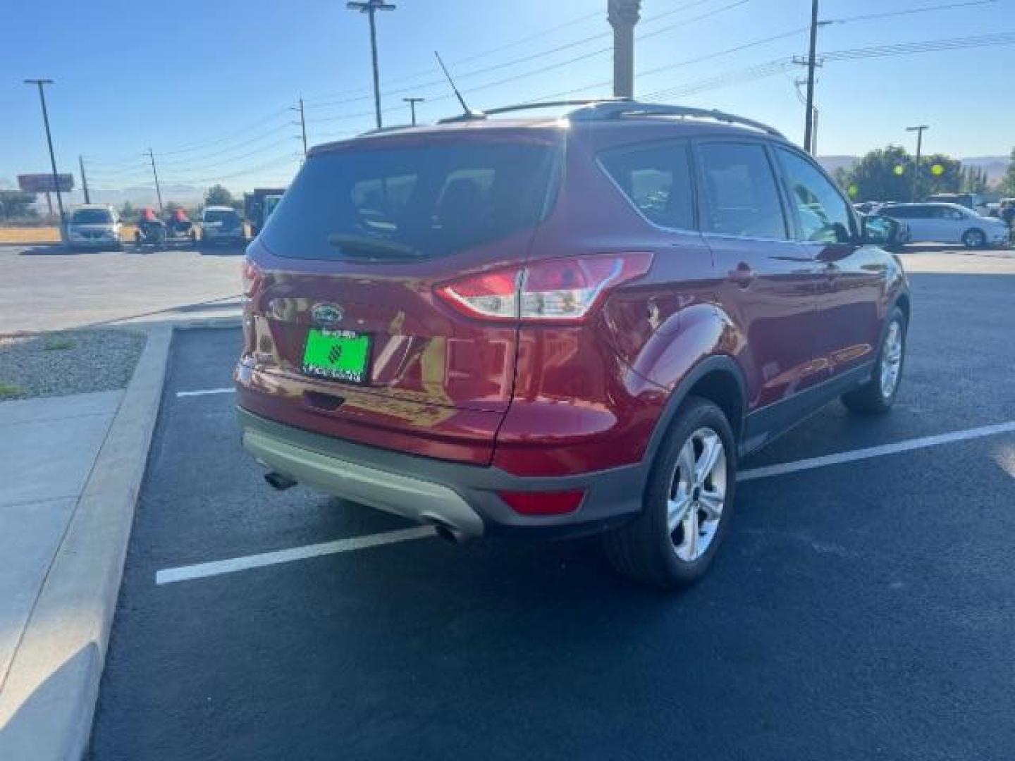 2015 Ruby Red Met Tinted CC /Charcoal Black Ford Escape SE FWD (1FMCU0G79FU) with an 2.5L L4 DOHC 16V engine, 6-Speed Automatic transmission, located at 1865 East Red Hills Pkwy, St. George, 84770, (435) 628-0023, 37.120850, -113.543640 - Photo#4