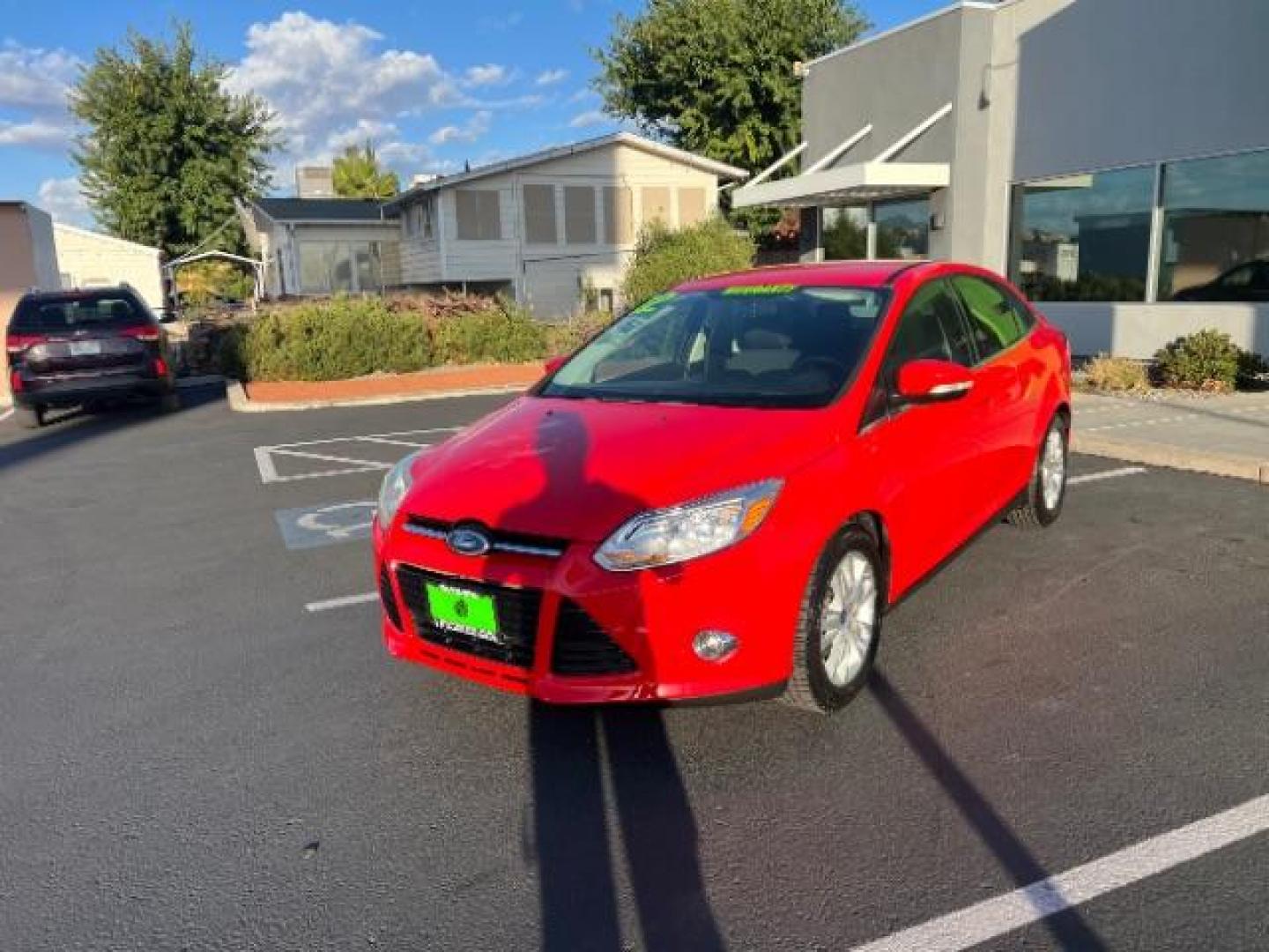 2012 Race Red /Charcoal Black Cloth/Leather Interior Ford Focus SEL Sedan (1FAHP3H29CL) with an 2.0L L4 DOHC 16V engine, 6-Speed Automatic transmission, located at 1865 East Red Hills Pkwy, St. George, 84770, (435) 628-0023, 37.120850, -113.543640 - We specialize in helping ALL people get the best financing available. No matter your credit score, good, bad or none we can get you an amazing rate. Had a bankruptcy, divorce, or repossessions? We give you the green light to get your credit back on the road. Low down and affordable payments that fit - Photo#2