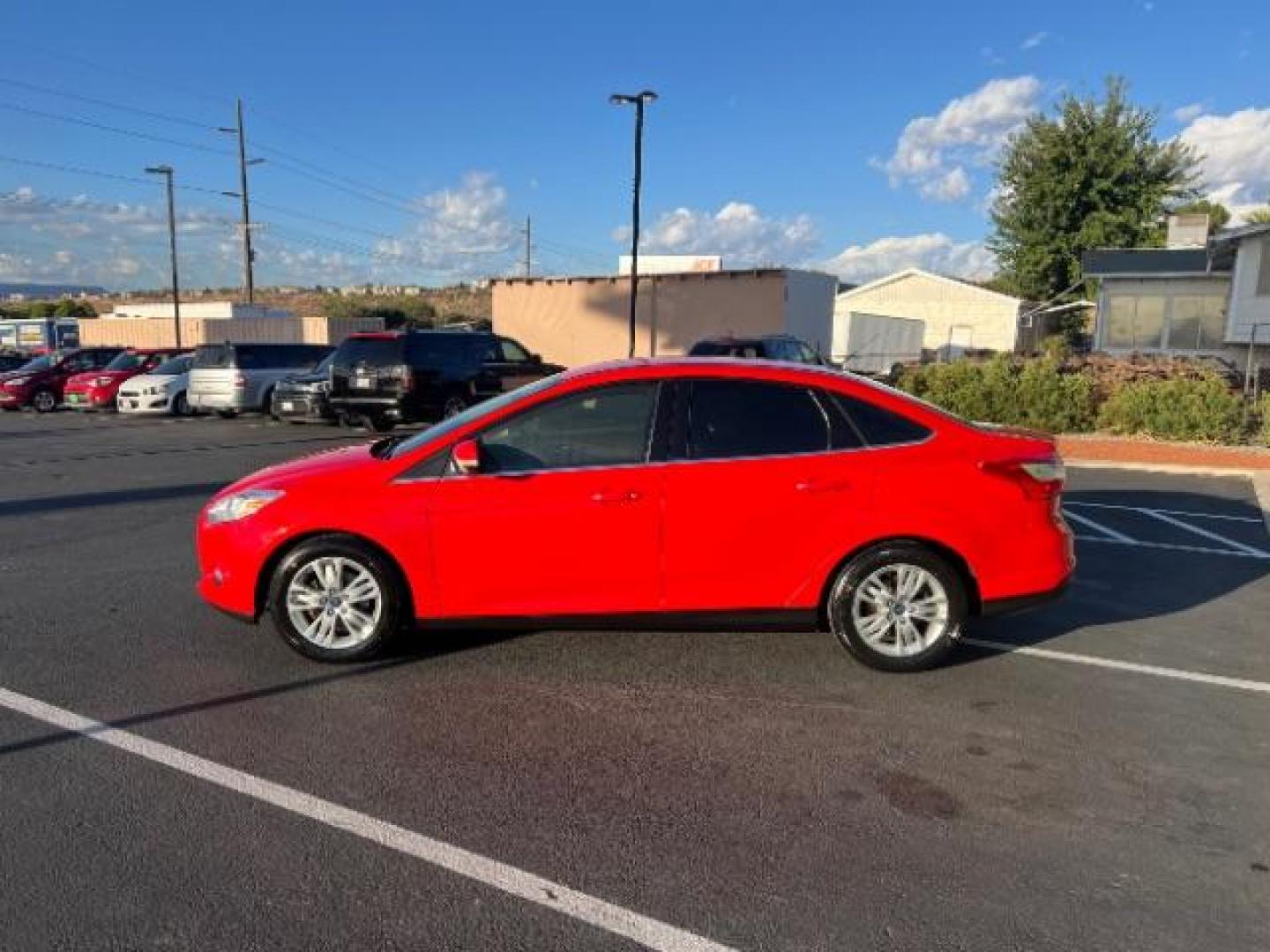 2012 Race Red /Charcoal Black Cloth/Leather Interior Ford Focus SEL Sedan (1FAHP3H29CL) with an 2.0L L4 DOHC 16V engine, 6-Speed Automatic transmission, located at 1865 East Red Hills Pkwy, St. George, 84770, (435) 628-0023, 37.120850, -113.543640 - We specialize in helping ALL people get the best financing available. No matter your credit score, good, bad or none we can get you an amazing rate. Had a bankruptcy, divorce, or repossessions? We give you the green light to get your credit back on the road. Low down and affordable payments that fit - Photo#3