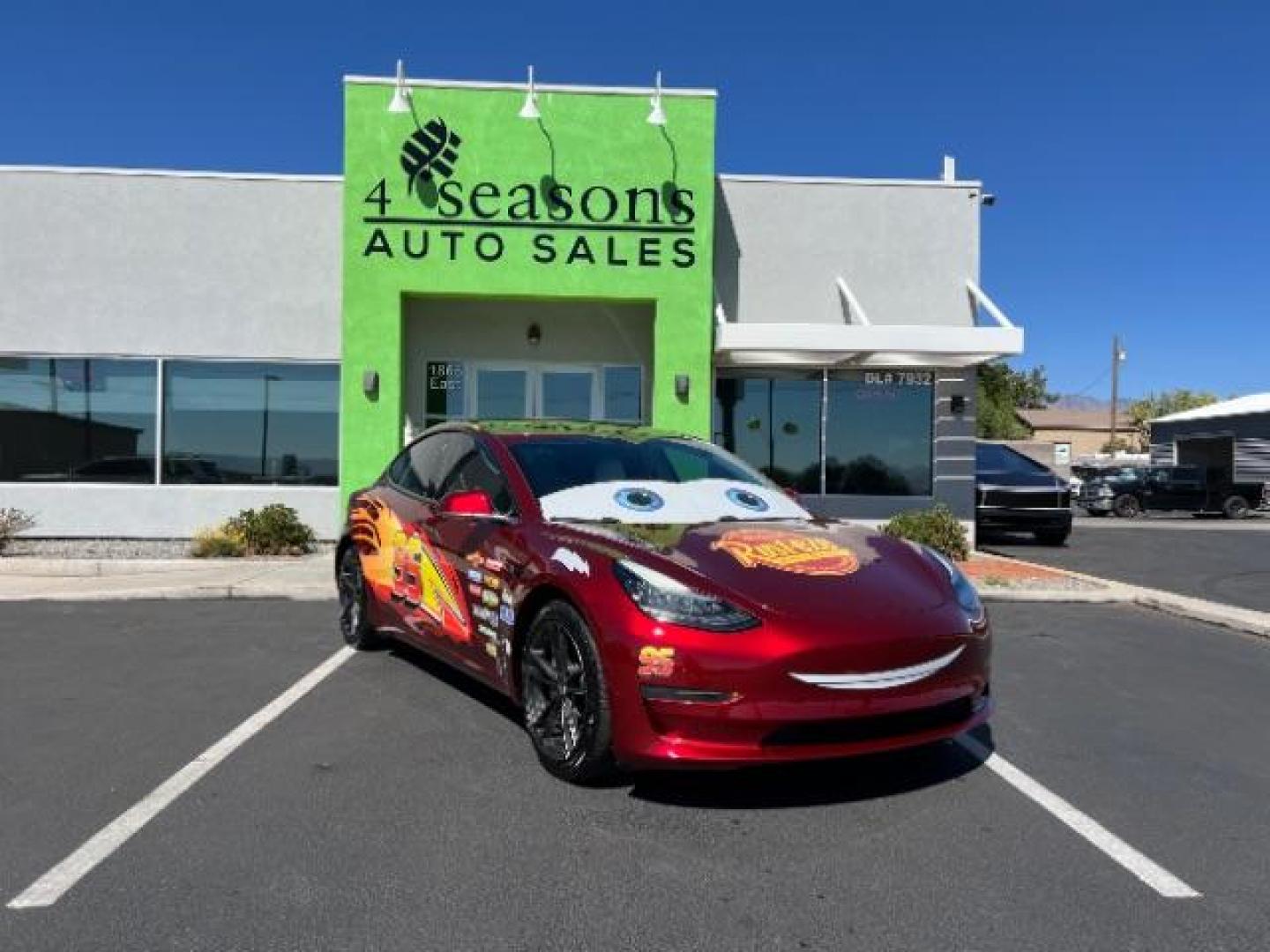 2018 Red /White Tesla Model 3 Long Range (5YJ3E1EB3JF) with an ELECTRIC engine, 1-Speed Automatic transmission, located at 1865 East Red Hills Pkwy, St. George, 84770, (435) 628-0023, 37.120850, -113.543640 - Your chance to own the most unique Tesla in town! Lightning McQueen is guaranteed to turn heads and make kids smile. A Long Range All Wheel Drive model 3 with aftermarket wheels ($1,000 Upgrade), spoiler and of course the coolest wrap in the state ($3,500 upgrade). WARRANTY on battery and motor un - Photo#0