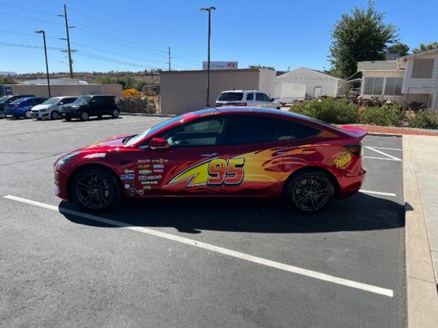 2018 Red /White Tesla Model 3 Long Range (5YJ3E1EB3JF) with an ELECTRIC engine, 1-Speed Automatic transmission, located at 1865 East Red Hills Pkwy, St. George, 84770, (435) 628-0023, 37.120850, -113.543640 - Your chance to own the most unique Tesla in town! Lightning McQueen is guaranteed to turn heads and make kids smile. A Long Range All Wheel Drive model 3 with aftermarket wheels ($1,000 Upgrade), spoiler and of course the coolest wrap in the state ($3,500 upgrade). WARRANTY on battery and motor un - Photo#4