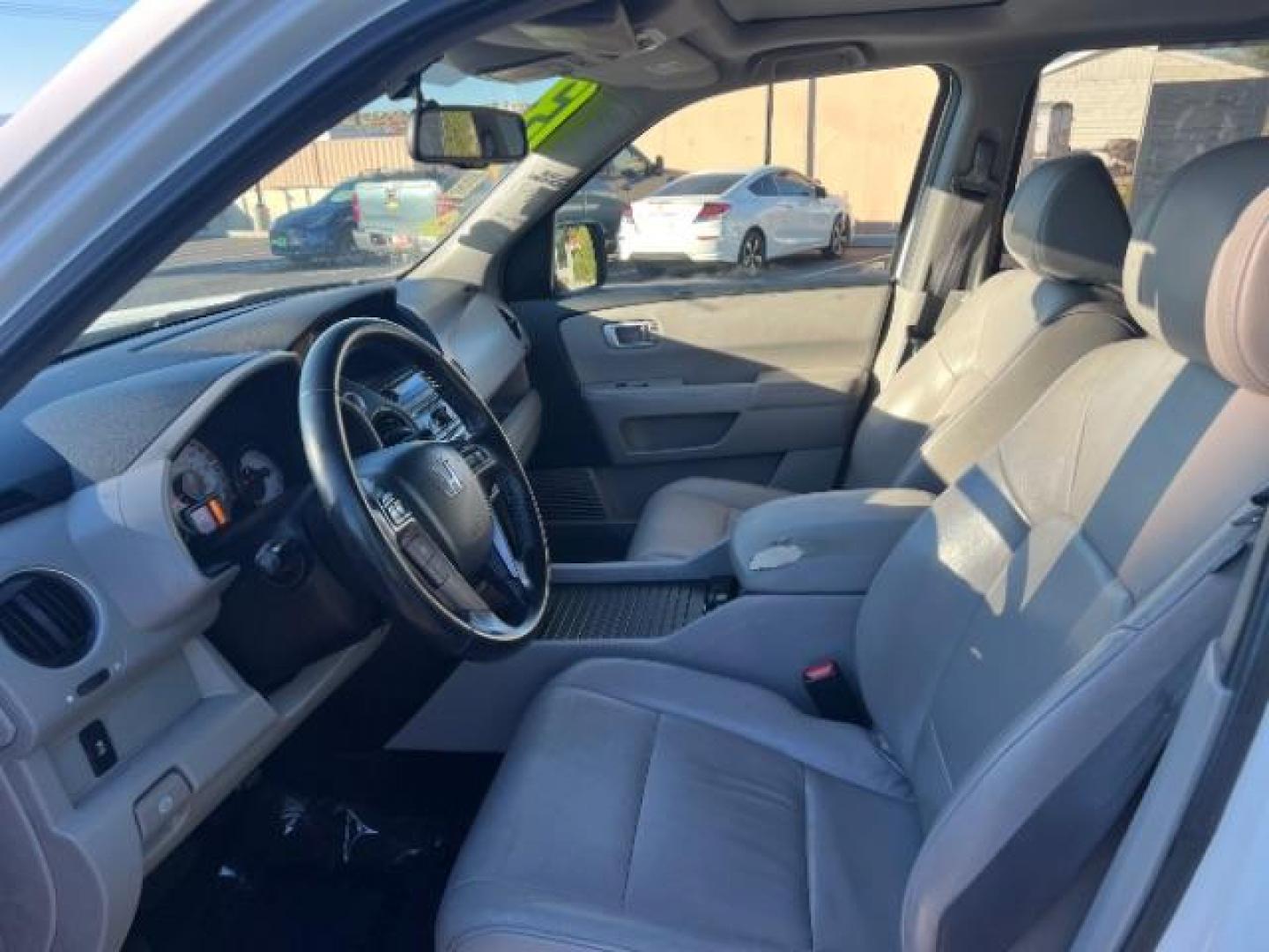 2013 Taffeta White /Beige Leather Interior Honda Pilot EX-L 4WD 5-Spd AT (5FNYF4H50DB) with an 3.5L V6 SOHC 24V engine, 5-Speed Automatic transmission, located at 1865 East Red Hills Pkwy, St. George, 84770, (435) 628-0023, 37.120850, -113.543640 - We specialize in helping ALL people get the best financing available. No matter your credit score, good, bad or none we can get you an amazing rate. Had a bankruptcy, divorce, or repossessions? We give you the green light to get your credit back on the road. Low down and affordable payments that fit - Photo#16