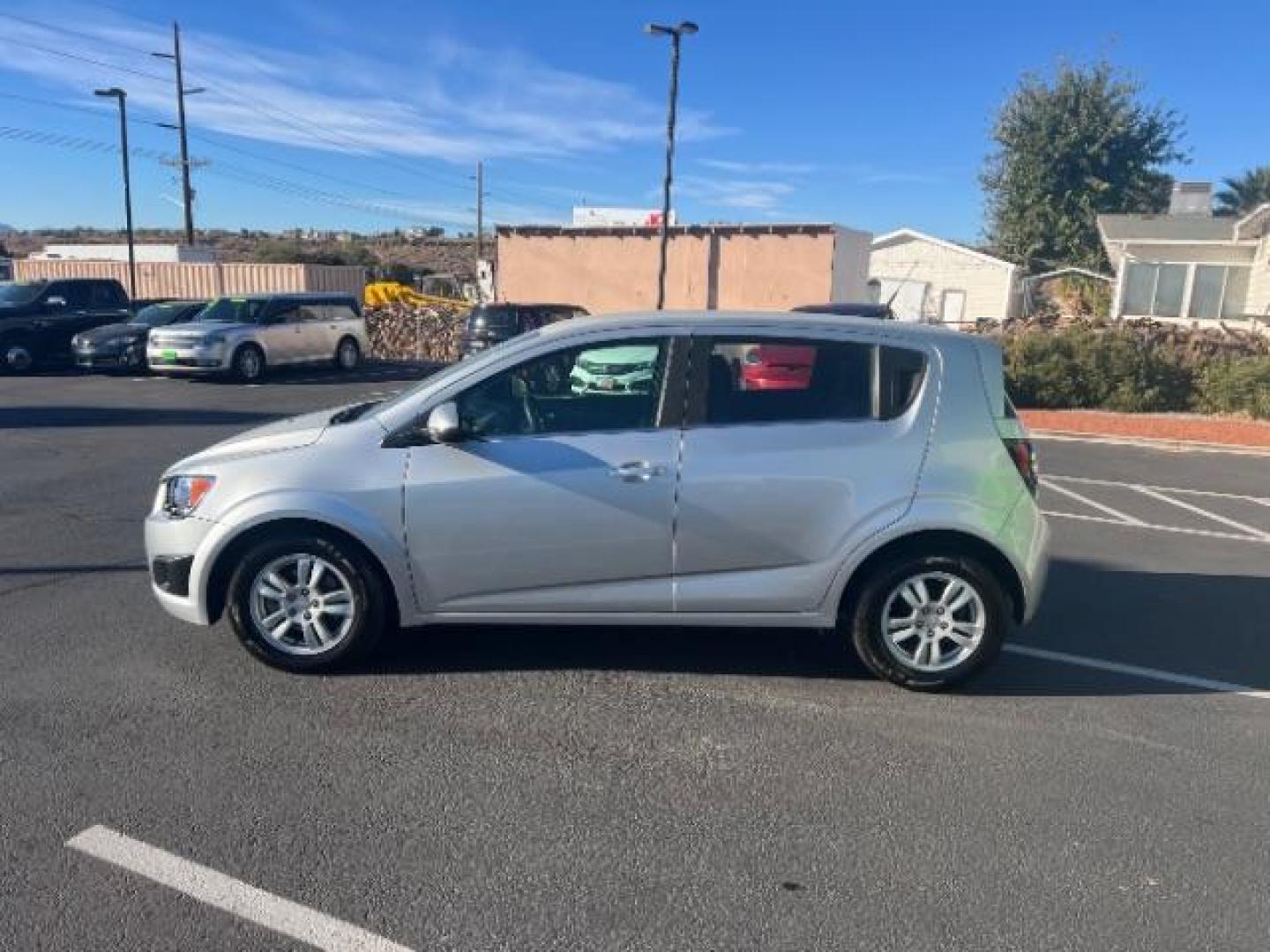 2013 Silver Ice Metallic /Dark Pewter/Dark Titanium Cloth Interior Chevrolet Sonic LT Auto 5-Door (1G1JC6SG9D4) with an 1.8L L4 DOHC 24V engine, 6-Speed Automatic transmission, located at 940 North Main Street, Cedar City, UT, 84720, (435) 628-0023, 37.692936, -113.061897 - We specialize in helping ALL people get the best financing available. No matter your credit score, good, bad or none we can get you an amazing rate. Had a bankruptcy, divorce, or repossessions? We give you the green light to get your credit back on the road. Low down and affordable payments that fit - Photo#3