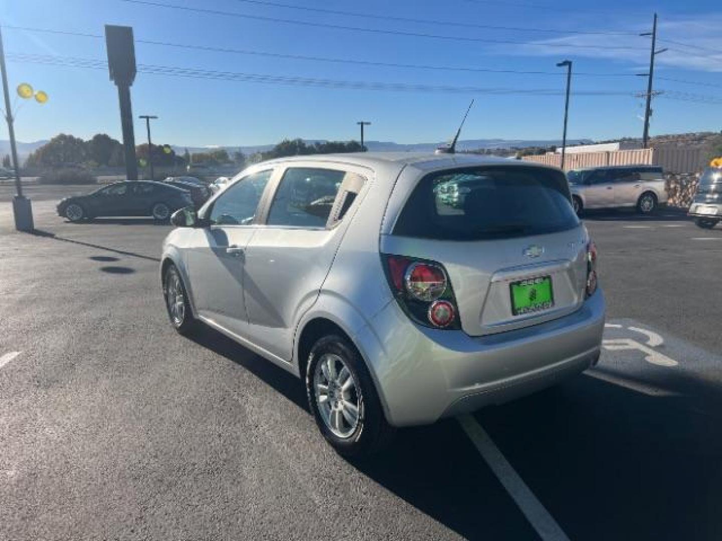 2013 Silver Ice Metallic /Dark Pewter/Dark Titanium Cloth Interior Chevrolet Sonic LT Auto 5-Door (1G1JC6SG9D4) with an 1.8L L4 DOHC 24V engine, 6-Speed Automatic transmission, located at 940 North Main Street, Cedar City, UT, 84720, (435) 628-0023, 37.692936, -113.061897 - We specialize in helping ALL people get the best financing available. No matter your credit score, good, bad or none we can get you an amazing rate. Had a bankruptcy, divorce, or repossessions? We give you the green light to get your credit back on the road. Low down and affordable payments that fit - Photo#4