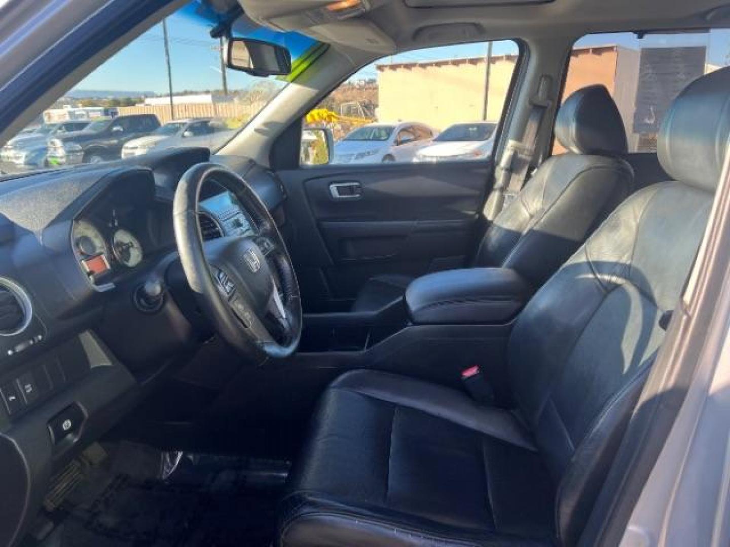 2011 Alabaster Silver Metallic /Black Leather Interior Honda Pilot Touring 4WD 5-Spd AT with DVD (5FNYF4H98BB) with an 3.5L V6 SOHC 24V engine, 5-Speed Automatic transmission, located at 940 North Main Street, Cedar City, UT, 84720, (435) 628-0023, 37.692936, -113.061897 - We specialize in helping ALL people get the best financing available. No matter your credit score, good, bad or none we can get you an amazing rate. Had a bankruptcy, divorce, or repossessions? We give you the green light to get your credit back on the road. Low down and affordable payments that fit - Photo#16