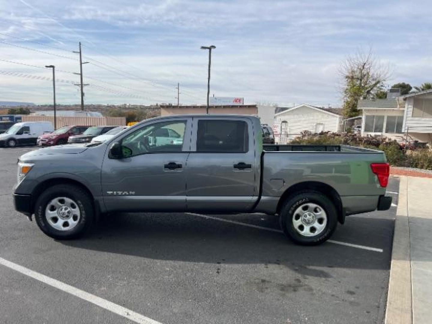 2017 Gun Metallic /Black, cloth Nissan Titan S Crew Cab 4WD (1N6AA1EJ6HN) with an 5.6L V8 DOHC 32V engine, 6-Speed Automatic transmission, located at 940 North Main Street, Cedar City, UT, 84720, (435) 628-0023, 37.692936, -113.061897 - Photo#3