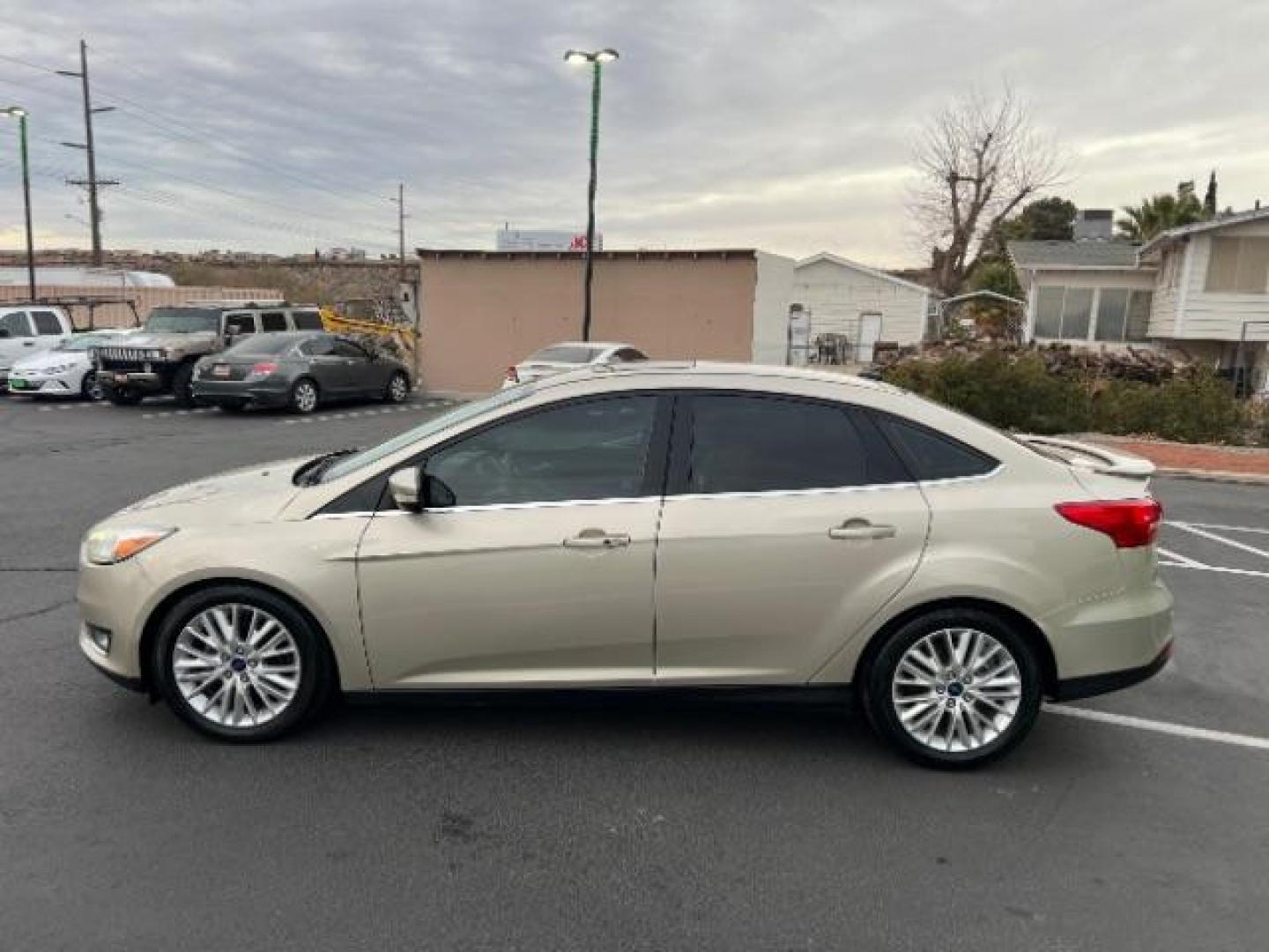 2018 White Gold Metallic /Medium Soft Ceramic, leather Ford Focus Titanium Sedan (1FADP3J27JL) with an 2.0L L4 DOHC 16V engine, 6-Speed Automatic transmission, located at 940 North Main Street, Cedar City, UT, 84720, (435) 628-0023, 37.692936, -113.061897 - We specialize in helping ALL people get the best financing available. No matter your credit score, good, bad or none we can get you an amazing rate. Had a bankruptcy, divorce, or repossessions? We give you the green light to get your credit back on the road. Low down and affordable payments that fit - Photo#3