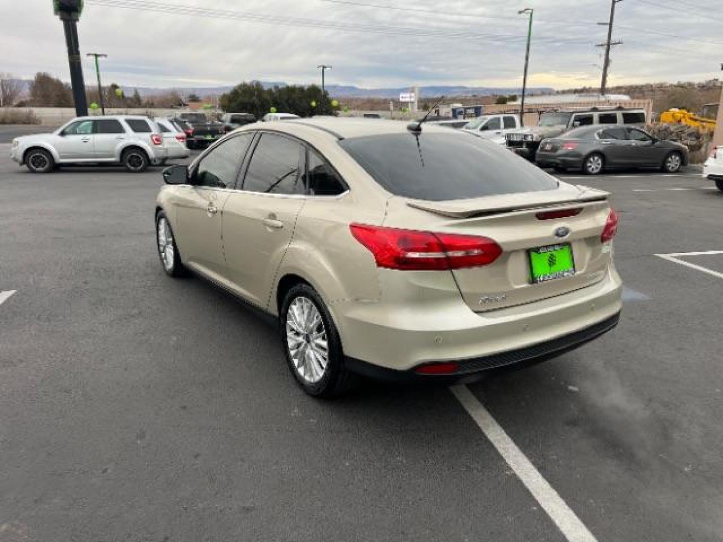 2018 White Gold Metallic /Medium Soft Ceramic, leather Ford Focus Titanium Sedan (1FADP3J27JL) with an 2.0L L4 DOHC 16V engine, 6-Speed Automatic transmission, located at 940 North Main Street, Cedar City, UT, 84720, (435) 628-0023, 37.692936, -113.061897 - We specialize in helping ALL people get the best financing available. No matter your credit score, good, bad or none we can get you an amazing rate. Had a bankruptcy, divorce, or repossessions? We give you the green light to get your credit back on the road. Low down and affordable payments that fit - Photo#4