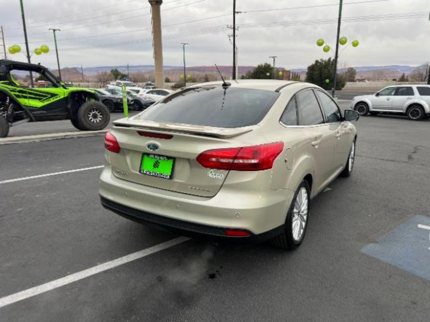 2018 White Gold Metallic /Medium Soft Ceramic, leather Ford Focus Titanium Sedan (1FADP3J27JL) with an 2.0L L4 DOHC 16V engine, 6-Speed Automatic transmission, located at 940 North Main Street, Cedar City, UT, 84720, (435) 628-0023, 37.692936, -113.061897 - We specialize in helping ALL people get the best financing available. No matter your credit score, good, bad or none we can get you an amazing rate. Had a bankruptcy, divorce, or repossessions? We give you the green light to get your credit back on the road. Low down and affordable payments that fit - Photo#6