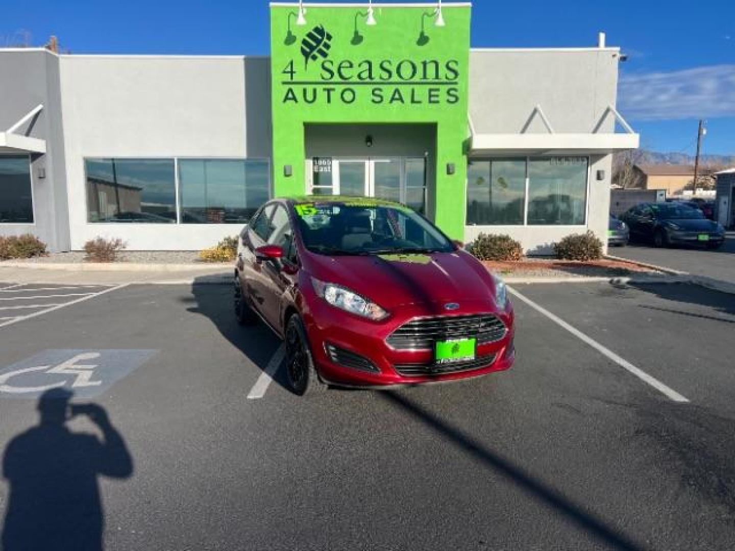 2015 Ruby Red Met Tinted CC /Charcoal Black w/Silver Ford Fiesta SE Sedan (3FADP4BJ0FM) with an 1.6L L4 DOHC 16V engine, 6-Speed Automatic transmission, located at 940 North Main Street, Cedar City, UT, 84720, (435) 628-0023, 37.692936, -113.061897 - We specialize in helping ALL people get the best financing available. No matter your credit score, good, bad or none we can get you an amazing rate. Had a bankruptcy, divorce, or repossessions? We give you the green light to get your credit back on the road. Low down and affordable payments that fit - Photo#0