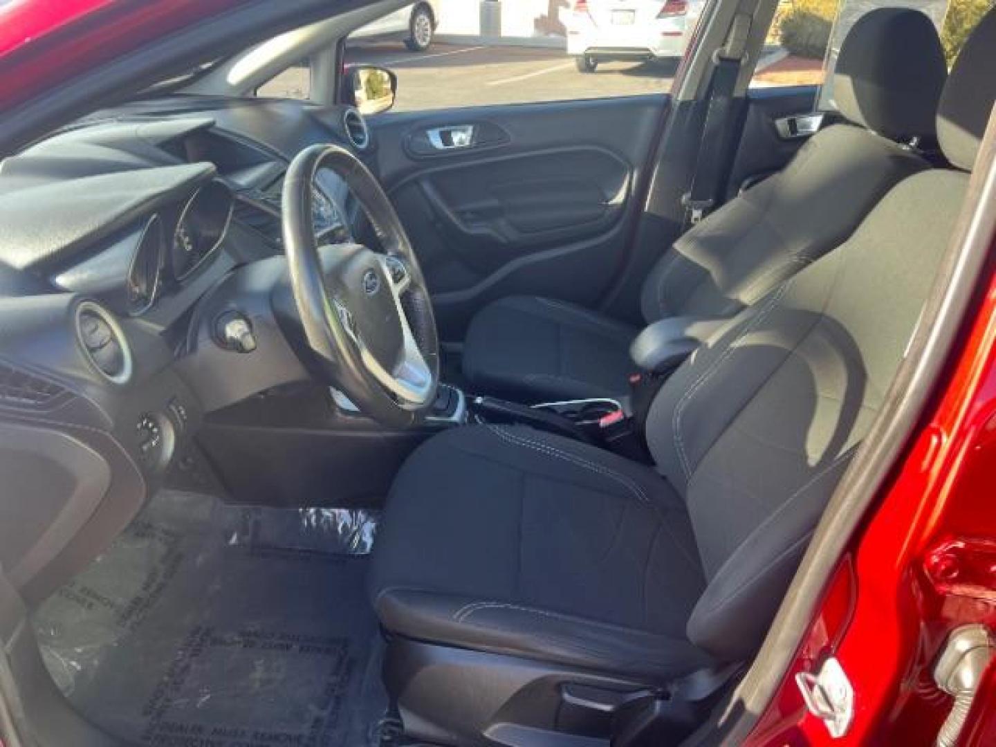 2015 Ruby Red Met Tinted CC /Charcoal Black w/Silver Ford Fiesta SE Sedan (3FADP4BJ0FM) with an 1.6L L4 DOHC 16V engine, 6-Speed Automatic transmission, located at 940 North Main Street, Cedar City, UT, 84720, (435) 628-0023, 37.692936, -113.061897 - We specialize in helping ALL people get the best financing available. No matter your credit score, good, bad or none we can get you an amazing rate. Had a bankruptcy, divorce, or repossessions? We give you the green light to get your credit back on the road. Low down and affordable payments that fit - Photo#12