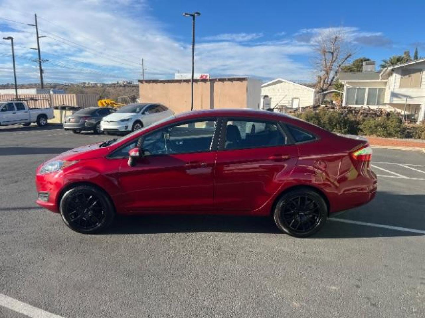 2015 Ruby Red Met Tinted CC /Charcoal Black w/Silver Ford Fiesta SE Sedan (3FADP4BJ0FM) with an 1.6L L4 DOHC 16V engine, 6-Speed Automatic transmission, located at 940 North Main Street, Cedar City, UT, 84720, (435) 628-0023, 37.692936, -113.061897 - We specialize in helping ALL people get the best financing available. No matter your credit score, good, bad or none we can get you an amazing rate. Had a bankruptcy, divorce, or repossessions? We give you the green light to get your credit back on the road. Low down and affordable payments that fit - Photo#3