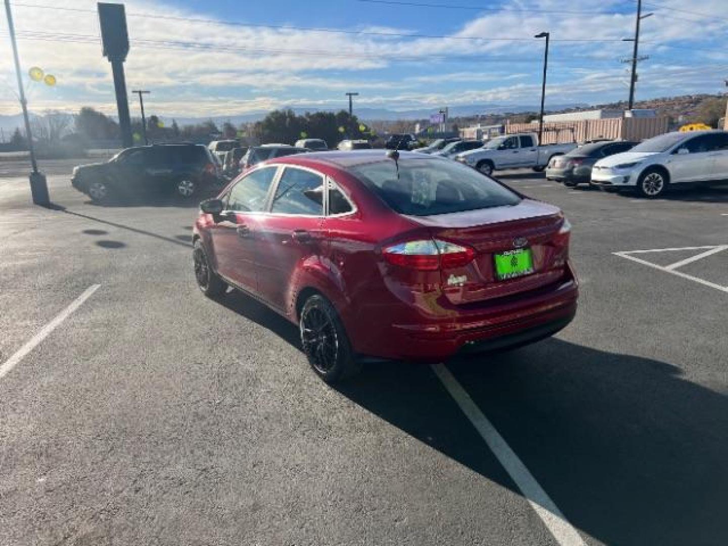 2015 Ruby Red Met Tinted CC /Charcoal Black w/Silver Ford Fiesta SE Sedan (3FADP4BJ0FM) with an 1.6L L4 DOHC 16V engine, 6-Speed Automatic transmission, located at 940 North Main Street, Cedar City, UT, 84720, (435) 628-0023, 37.692936, -113.061897 - We specialize in helping ALL people get the best financing available. No matter your credit score, good, bad or none we can get you an amazing rate. Had a bankruptcy, divorce, or repossessions? We give you the green light to get your credit back on the road. Low down and affordable payments that fit - Photo#4