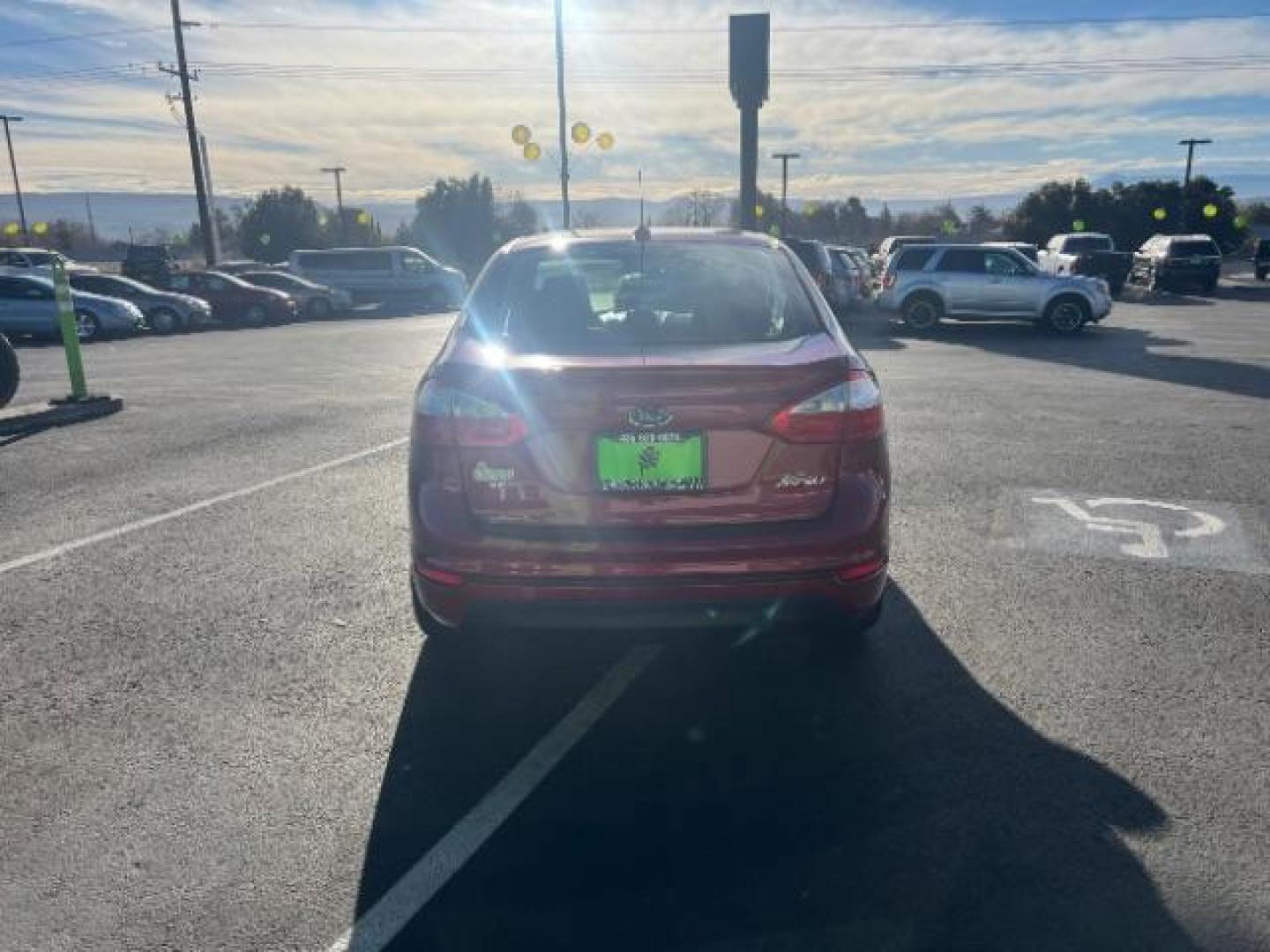 2015 Ruby Red Met Tinted CC /Charcoal Black w/Silver Ford Fiesta SE Sedan (3FADP4BJ0FM) with an 1.6L L4 DOHC 16V engine, 6-Speed Automatic transmission, located at 940 North Main Street, Cedar City, UT, 84720, (435) 628-0023, 37.692936, -113.061897 - We specialize in helping ALL people get the best financing available. No matter your credit score, good, bad or none we can get you an amazing rate. Had a bankruptcy, divorce, or repossessions? We give you the green light to get your credit back on the road. Low down and affordable payments that fit - Photo#5