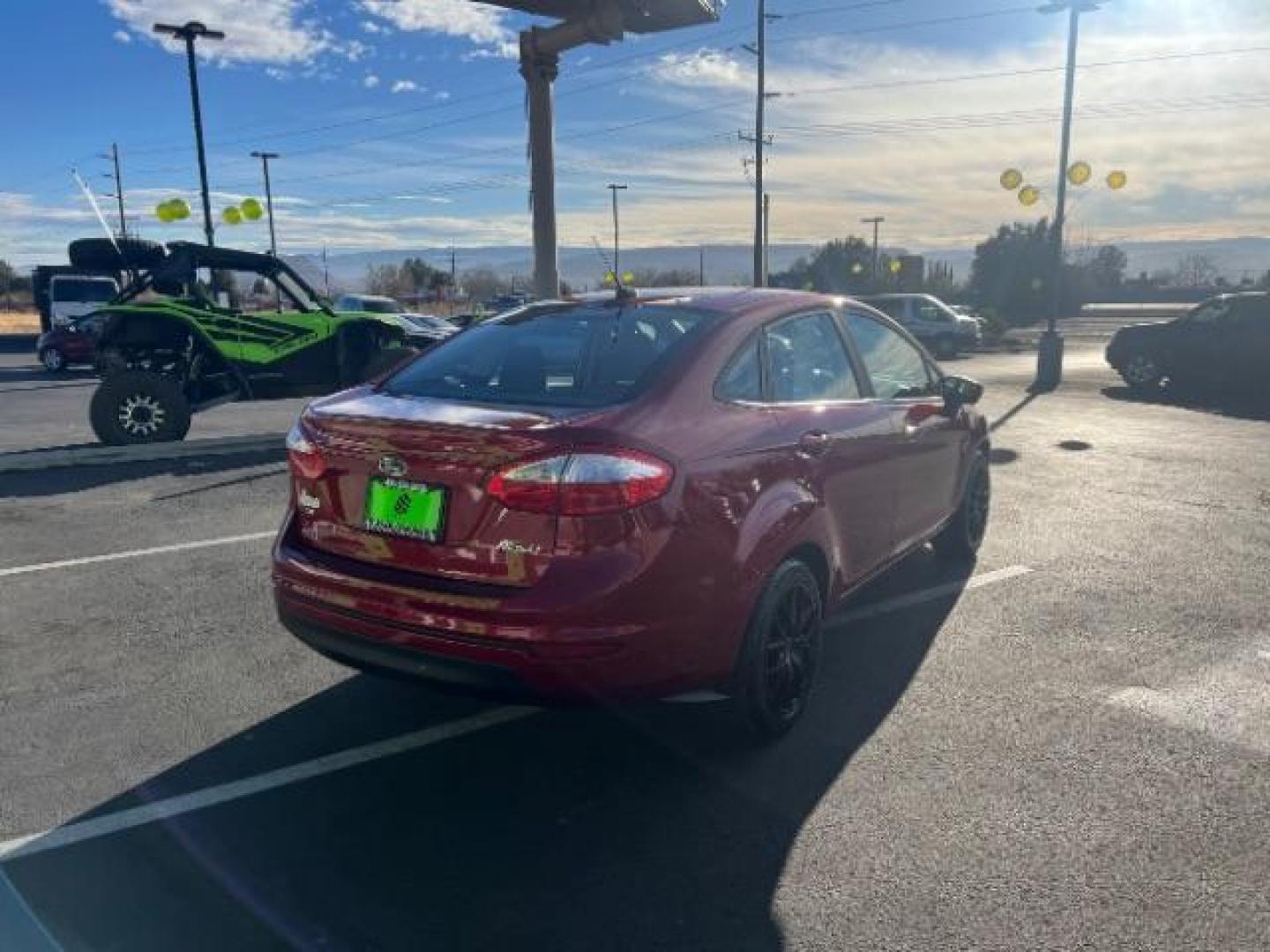 2015 Ruby Red Met Tinted CC /Charcoal Black w/Silver Ford Fiesta SE Sedan (3FADP4BJ0FM) with an 1.6L L4 DOHC 16V engine, 6-Speed Automatic transmission, located at 940 North Main Street, Cedar City, UT, 84720, (435) 628-0023, 37.692936, -113.061897 - We specialize in helping ALL people get the best financing available. No matter your credit score, good, bad or none we can get you an amazing rate. Had a bankruptcy, divorce, or repossessions? We give you the green light to get your credit back on the road. Low down and affordable payments that fit - Photo#6