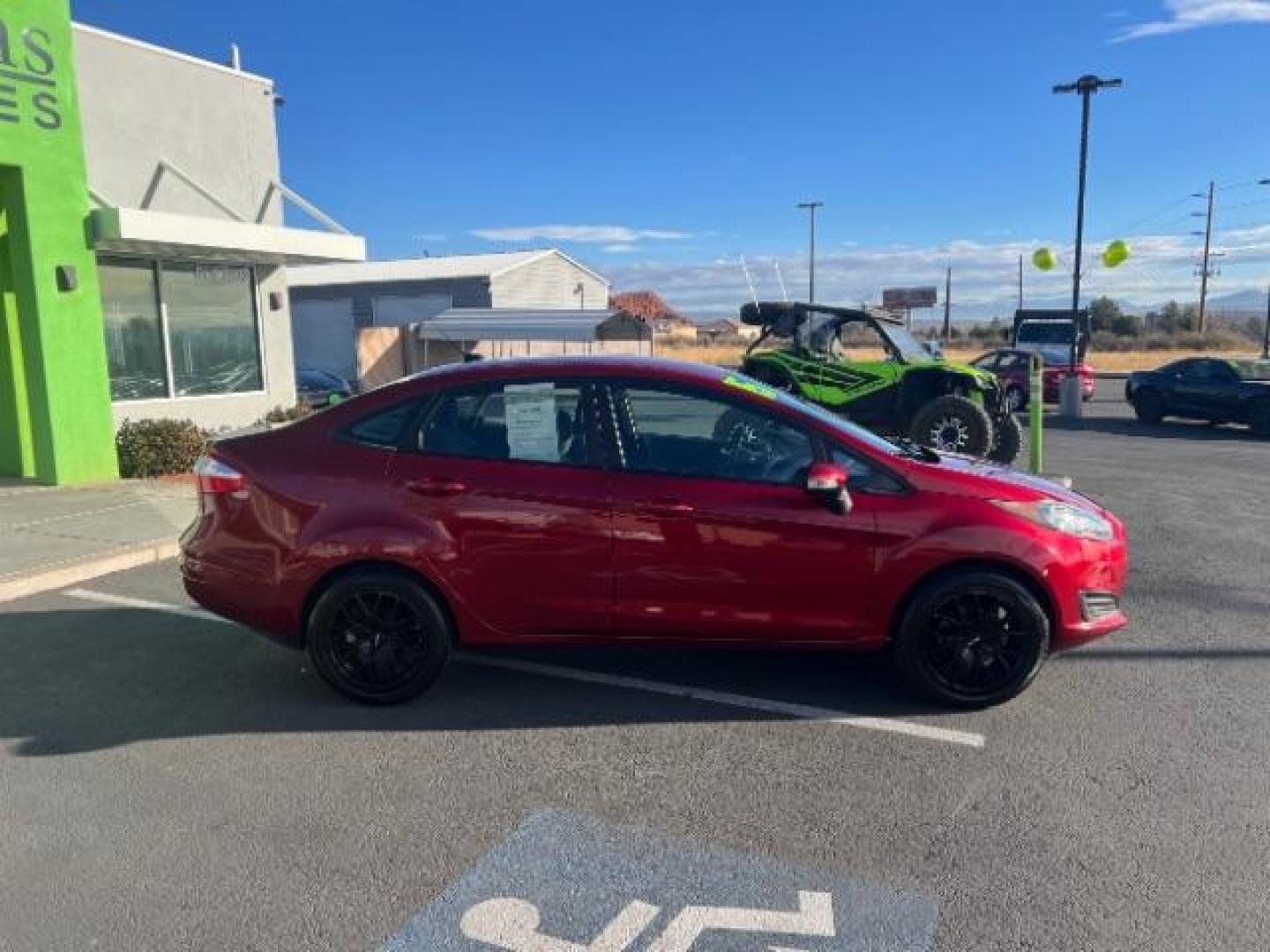 2015 Ruby Red Met Tinted CC /Charcoal Black w/Silver Ford Fiesta SE Sedan (3FADP4BJ0FM) with an 1.6L L4 DOHC 16V engine, 6-Speed Automatic transmission, located at 940 North Main Street, Cedar City, UT, 84720, (435) 628-0023, 37.692936, -113.061897 - We specialize in helping ALL people get the best financing available. No matter your credit score, good, bad or none we can get you an amazing rate. Had a bankruptcy, divorce, or repossessions? We give you the green light to get your credit back on the road. Low down and affordable payments that fit - Photo#7