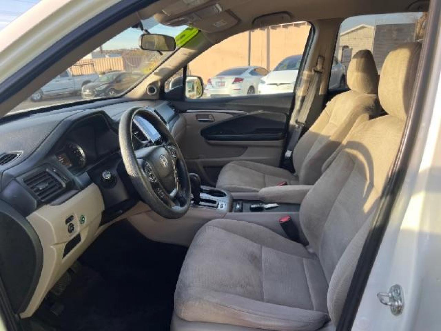 2016 White Diamond Pearl /Gray, cloth Honda Pilot EX 2WD (5FNYF5H35GB) with an 3.5L V6 SOHC 24V engine, 6-Speed Automatic transmission, located at 940 North Main Street, Cedar City, UT, 84720, (435) 628-0023, 37.692936, -113.061897 - We specialize in helping ALL people get the best financing available. No matter your credit score, good, bad or none we can get you an amazing rate. Had a bankruptcy, divorce, or repossessions? We give you the green light to get your credit back on the road. Low down and affordable payments that fit - Photo#16