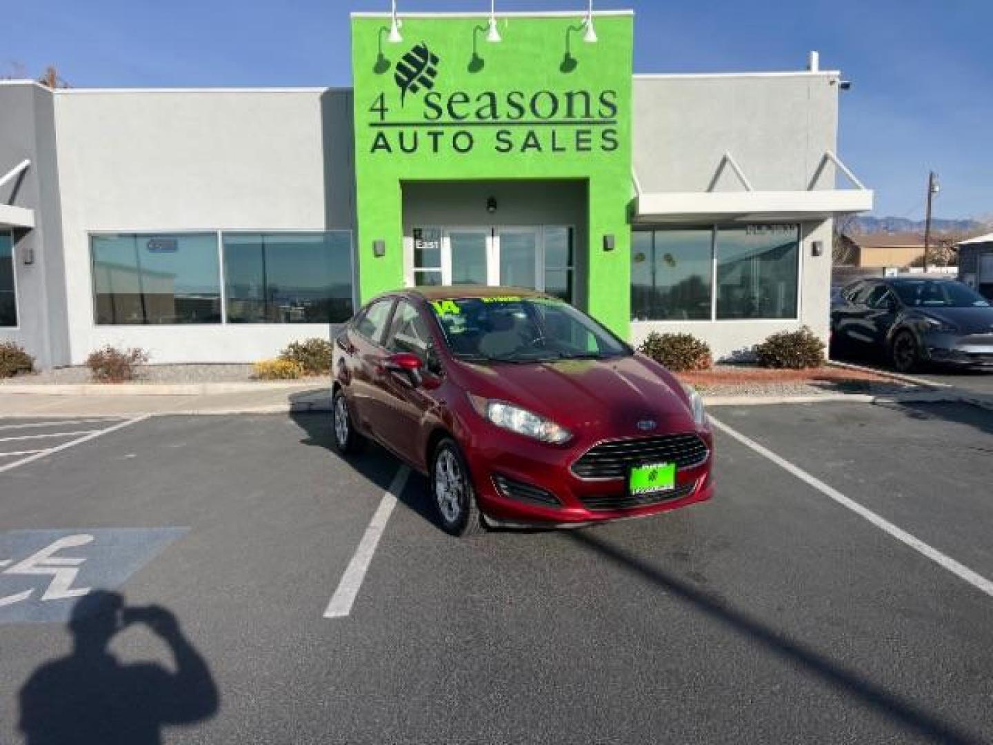 2014 Ruby Red Met Tinted CC /Charcoal Black w/Silver Ford Fiesta SE Sedan (3FADP4BJ1EM) with an 1.6L L4 DOHC 16V engine, 6-Speed Automatic transmission, located at 1865 East Red Hills Pkwy, St. George, 84770, (435) 628-0023, 37.120850, -113.543640 - We specialize in helping ALL people get the best financing available. No matter your credit score, good, bad or none we can get you an amazing rate. Had a bankruptcy, divorce, or repossessions? We give you the green light to get your credit back on the road. Low down and affordable payments that fit - Photo#0