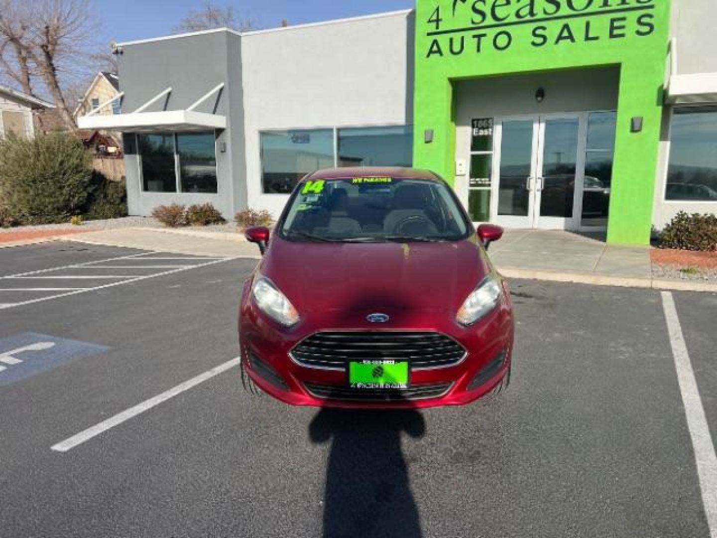 2014 Ruby Red Met Tinted CC /Charcoal Black w/Silver Ford Fiesta SE Sedan (3FADP4BJ1EM) with an 1.6L L4 DOHC 16V engine, 6-Speed Automatic transmission, located at 1865 East Red Hills Pkwy, St. George, 84770, (435) 628-0023, 37.120850, -113.543640 - We specialize in helping ALL people get the best financing available. No matter your credit score, good, bad or none we can get you an amazing rate. Had a bankruptcy, divorce, or repossessions? We give you the green light to get your credit back on the road. Low down and affordable payments that fit - Photo#1