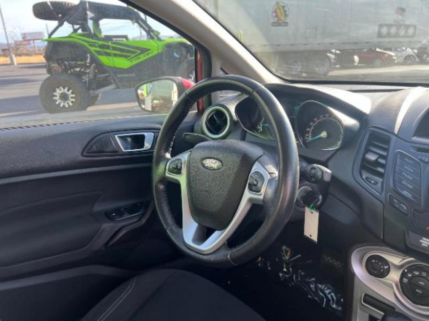 2014 Ruby Red Met Tinted CC /Charcoal Black w/Silver Ford Fiesta SE Sedan (3FADP4BJ1EM) with an 1.6L L4 DOHC 16V engine, 6-Speed Automatic transmission, located at 1865 East Red Hills Pkwy, St. George, 84770, (435) 628-0023, 37.120850, -113.543640 - We specialize in helping ALL people get the best financing available. No matter your credit score, good, bad or none we can get you an amazing rate. Had a bankruptcy, divorce, or repossessions? We give you the green light to get your credit back on the road. Low down and affordable payments that fit - Photo#31