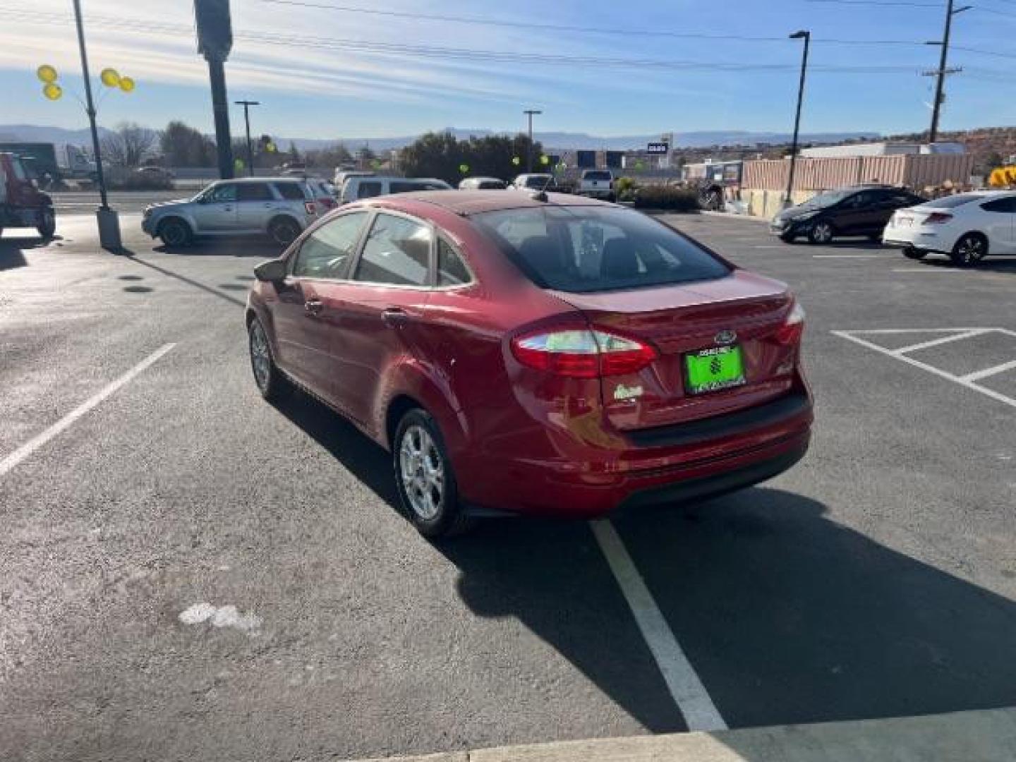 2014 Ruby Red Met Tinted CC /Charcoal Black w/Silver Ford Fiesta SE Sedan (3FADP4BJ1EM) with an 1.6L L4 DOHC 16V engine, 6-Speed Automatic transmission, located at 1865 East Red Hills Pkwy, St. George, 84770, (435) 628-0023, 37.120850, -113.543640 - We specialize in helping ALL people get the best financing available. No matter your credit score, good, bad or none we can get you an amazing rate. Had a bankruptcy, divorce, or repossessions? We give you the green light to get your credit back on the road. Low down and affordable payments that fit - Photo#4