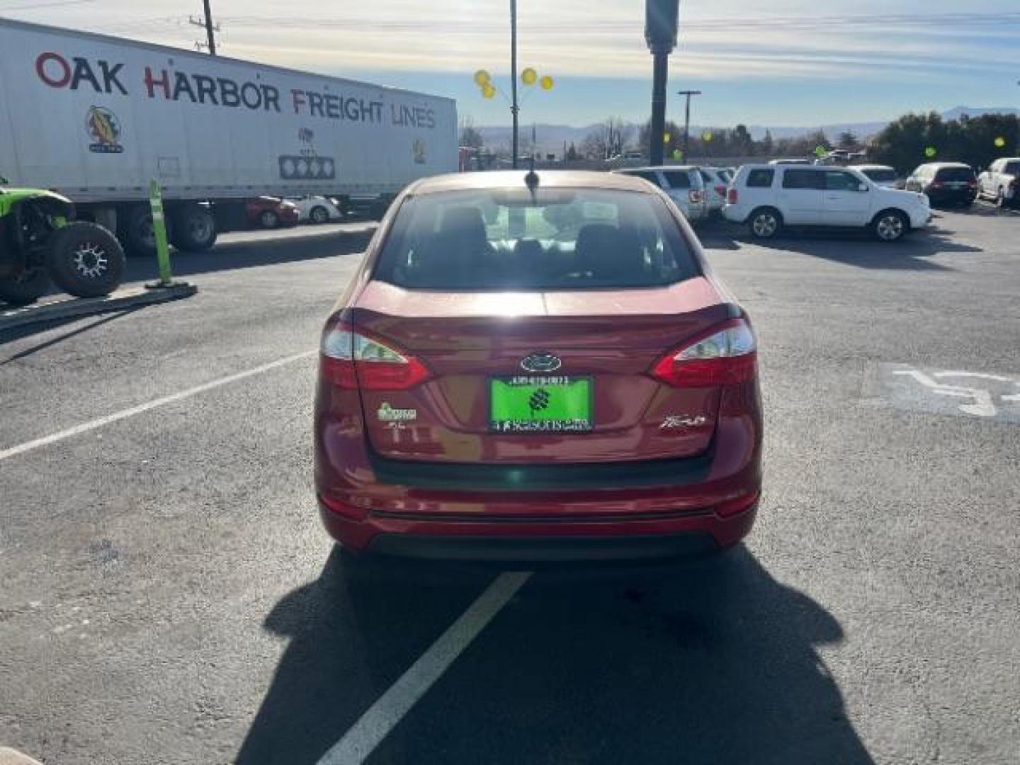 2014 Ruby Red Met Tinted CC /Charcoal Black w/Silver Ford Fiesta SE Sedan (3FADP4BJ1EM) with an 1.6L L4 DOHC 16V engine, 6-Speed Automatic transmission, located at 1865 East Red Hills Pkwy, St. George, 84770, (435) 628-0023, 37.120850, -113.543640 - We specialize in helping ALL people get the best financing available. No matter your credit score, good, bad or none we can get you an amazing rate. Had a bankruptcy, divorce, or repossessions? We give you the green light to get your credit back on the road. Low down and affordable payments that fit - Photo#5